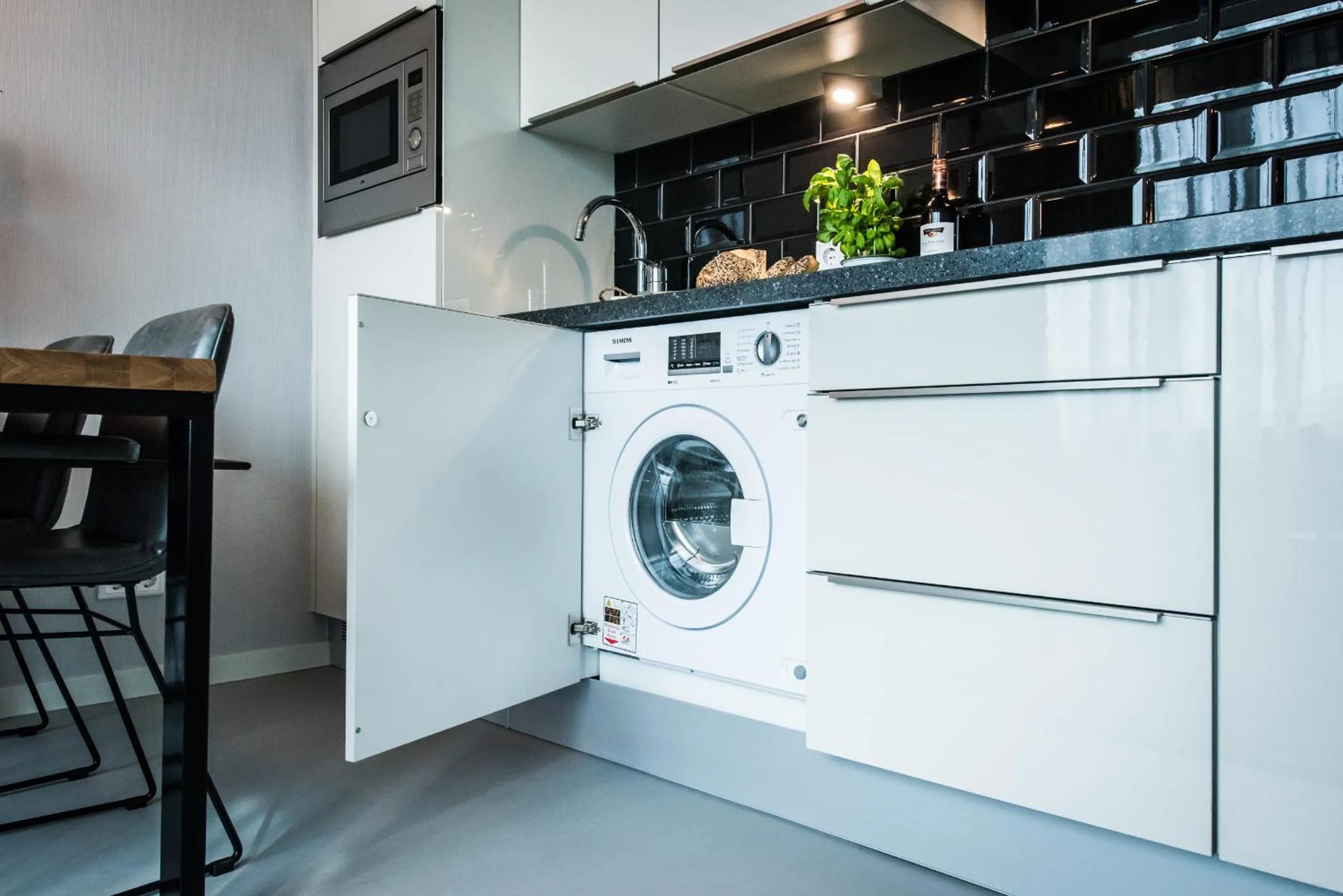 washing machine in YAYS Amsterdam East by Numa
