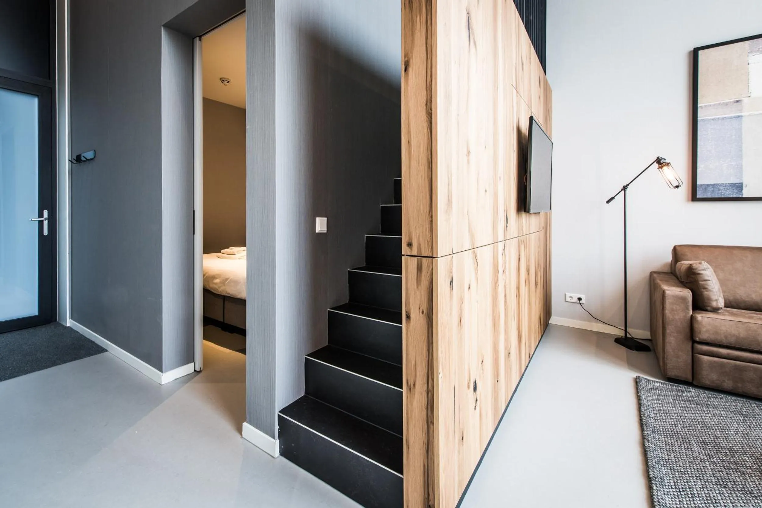 Living room, Bed in YAYS Amsterdam East by Numa