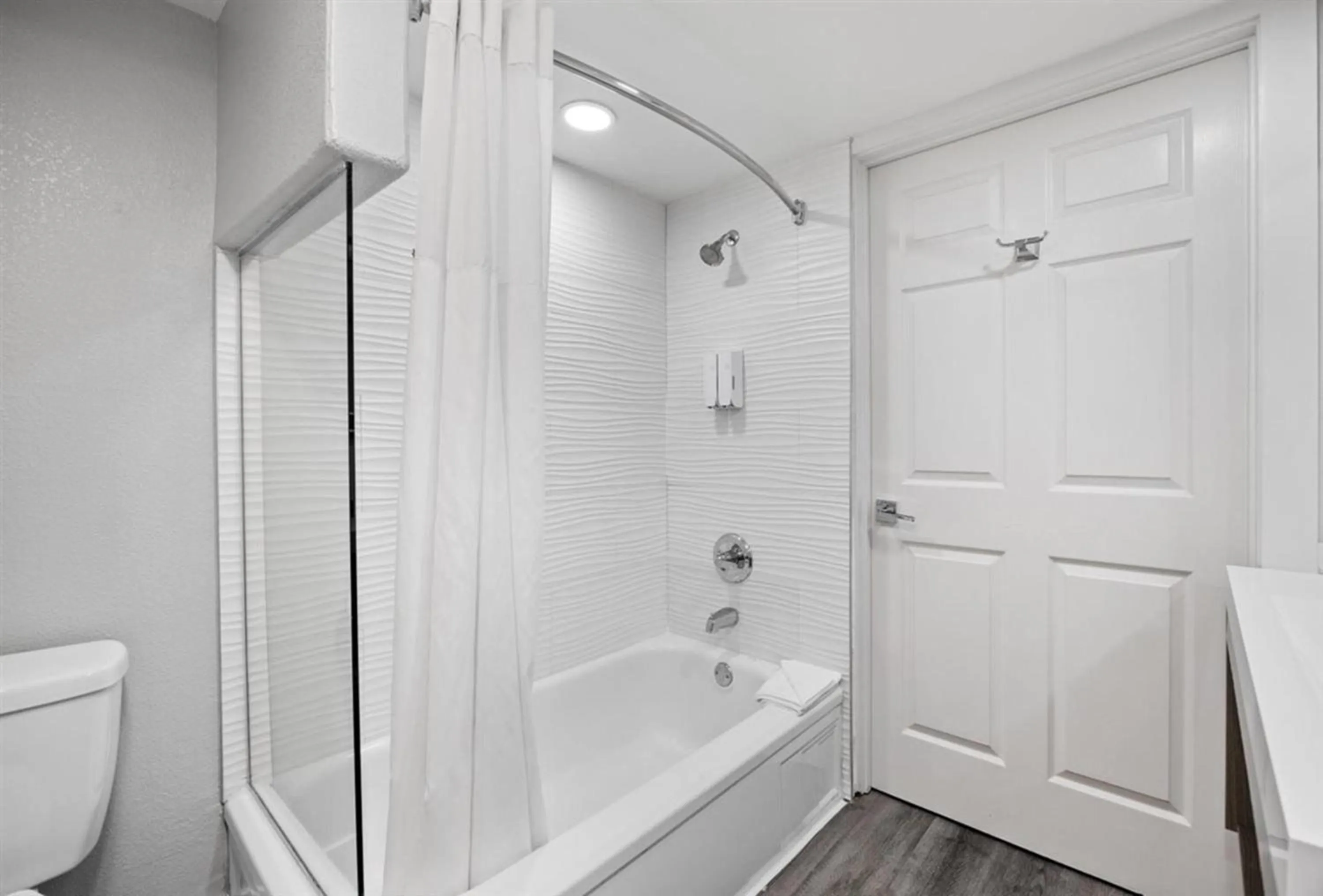 Bathroom in Prodigy Hotel, a Days Inn by Wyndham