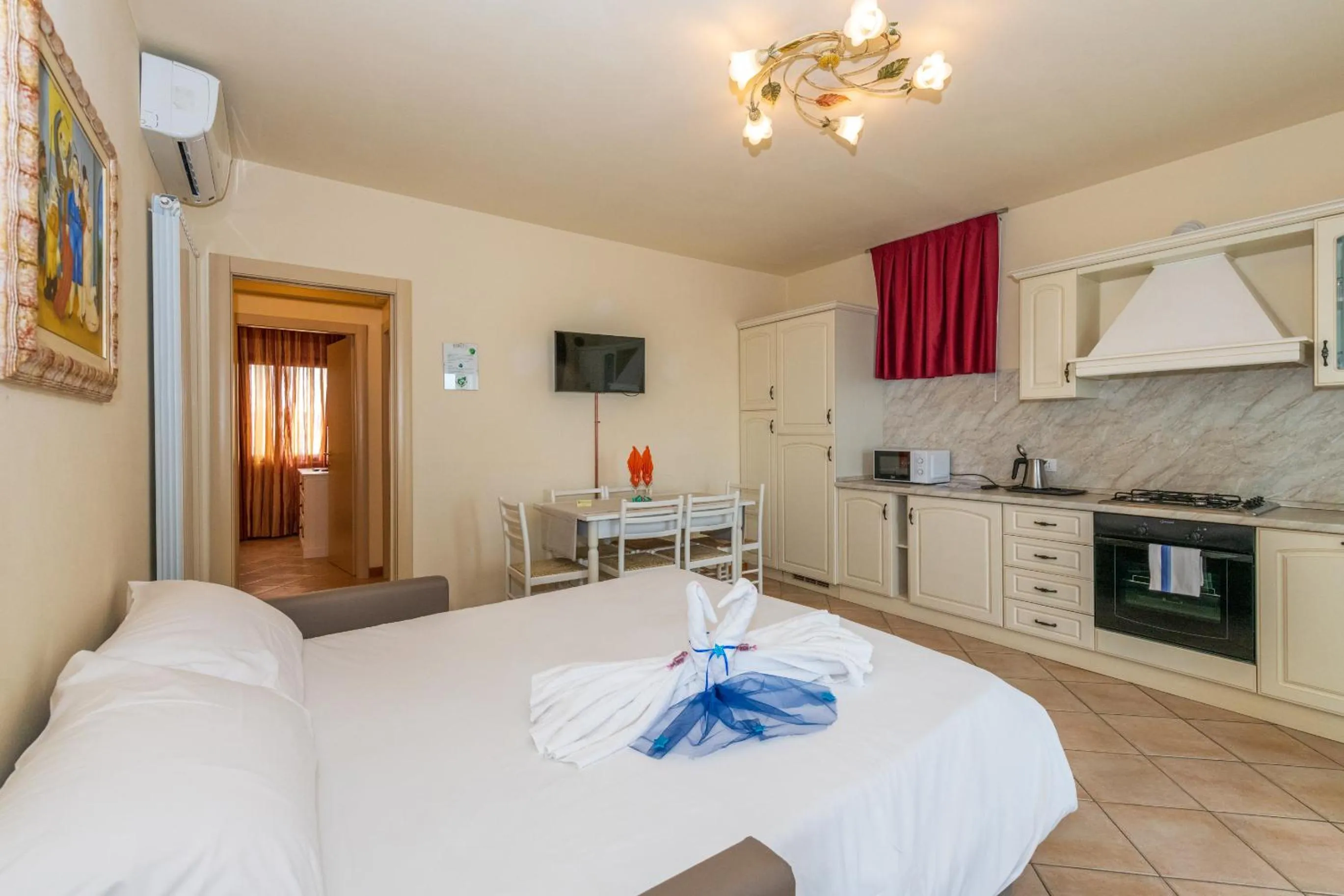 Living room, Bed in Bertoletta Village Apartments