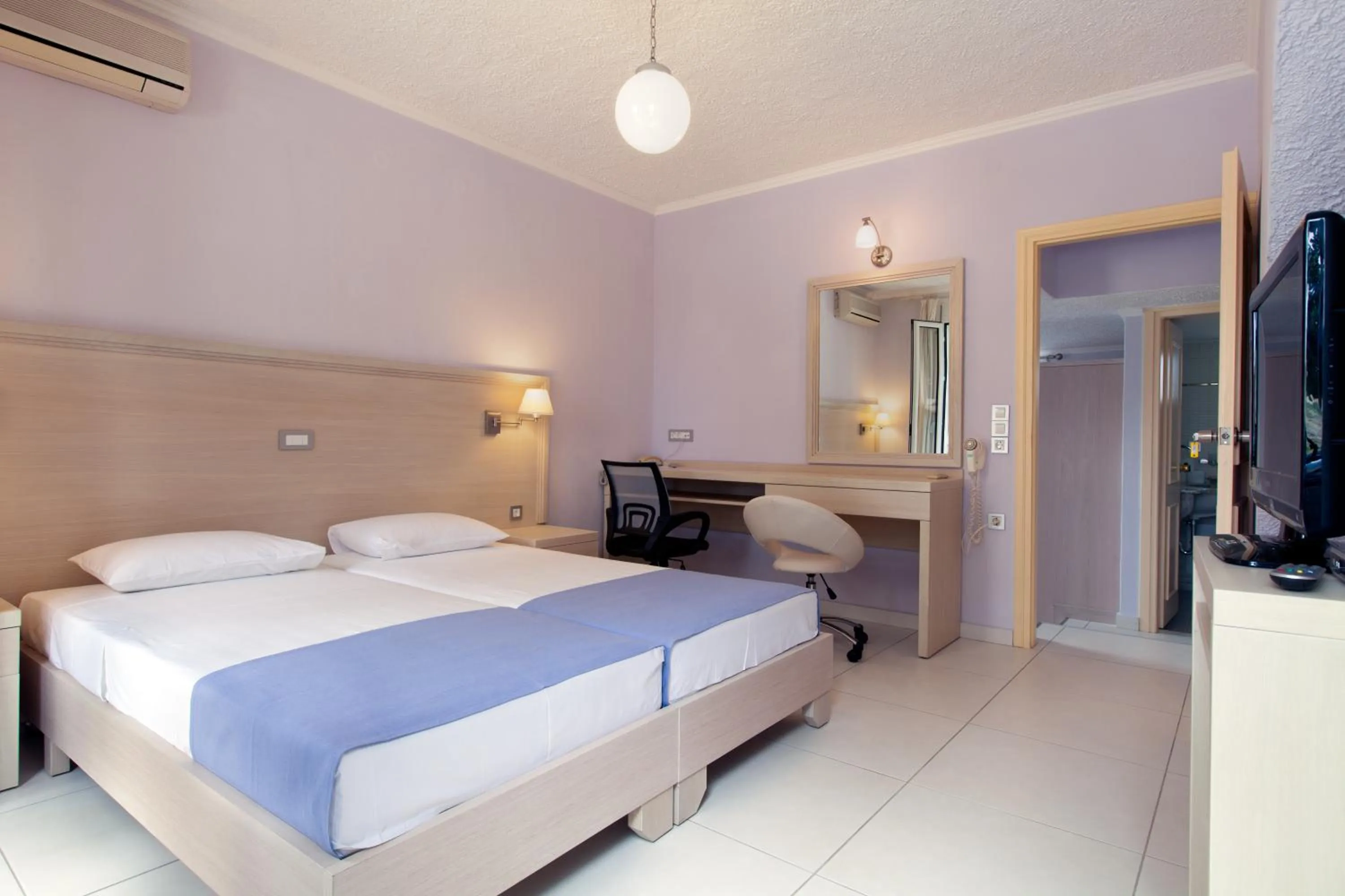 Bed in Giorgi's Blue Apartments