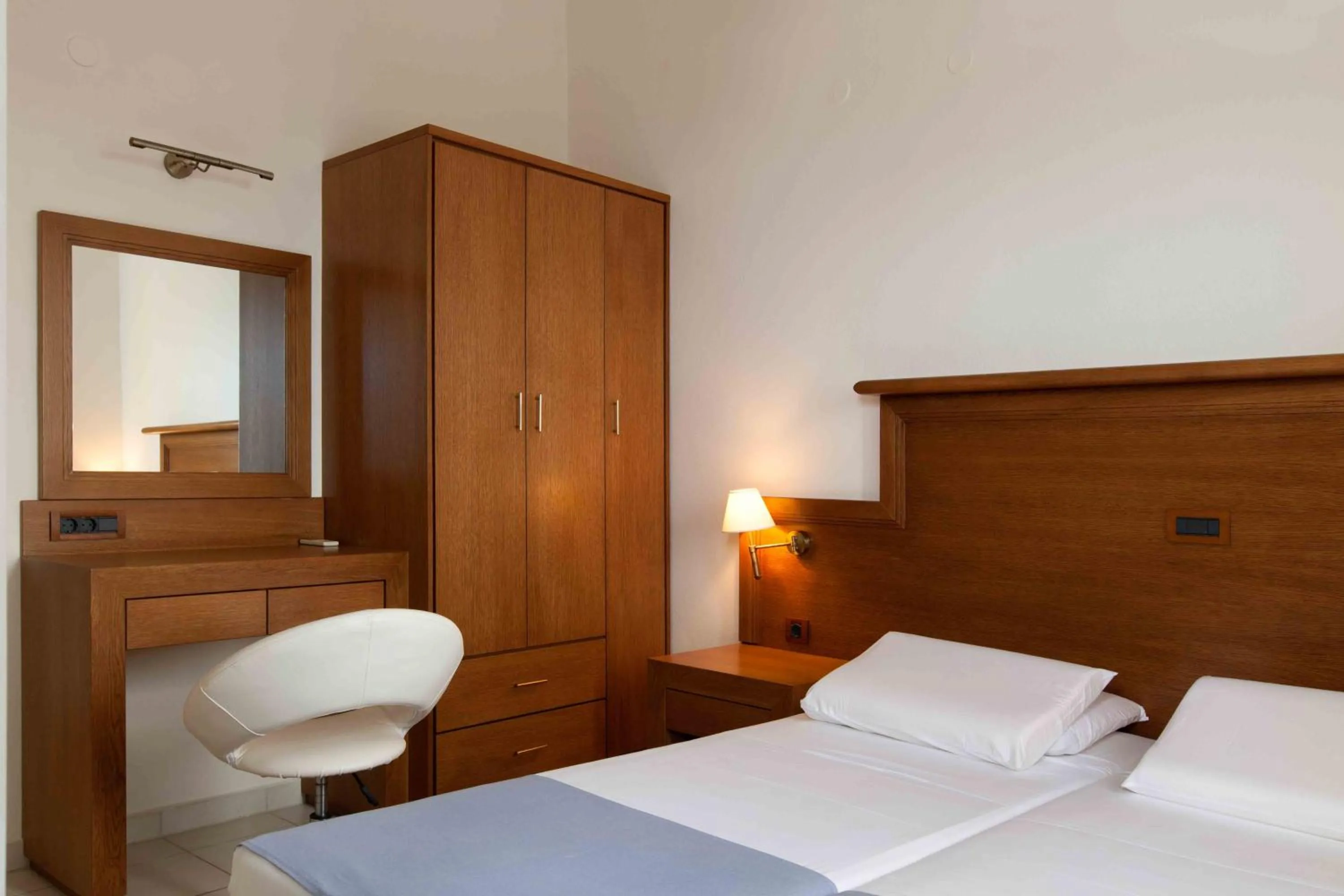 Bed in Giorgi's Blue Apartments