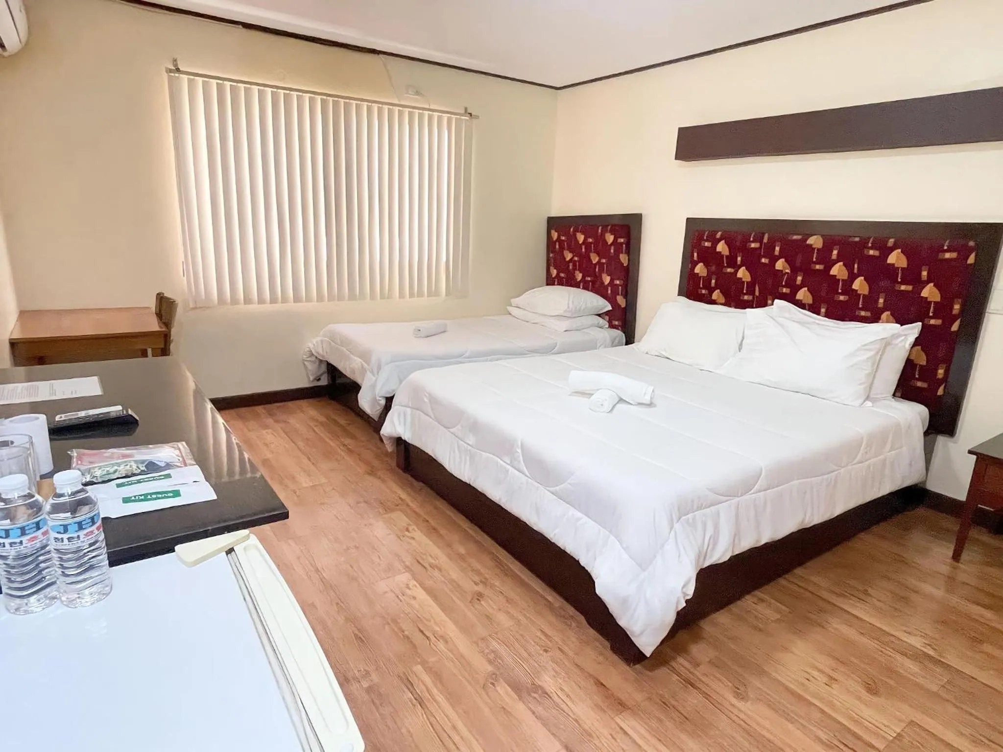 Bed in Jun and Helen Hotel and Restaurant