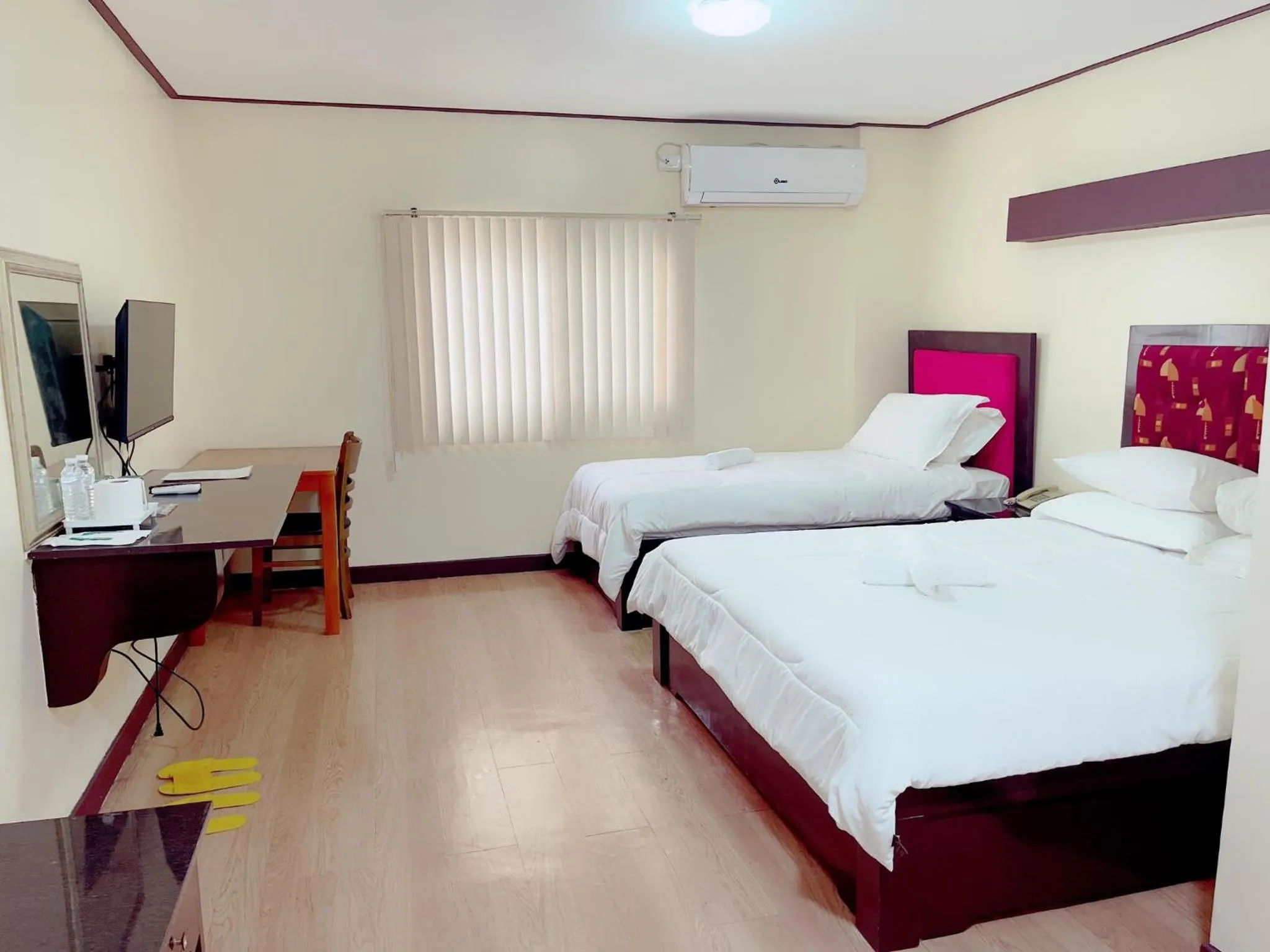 Bed in Jun and Helen Hotel and Restaurant