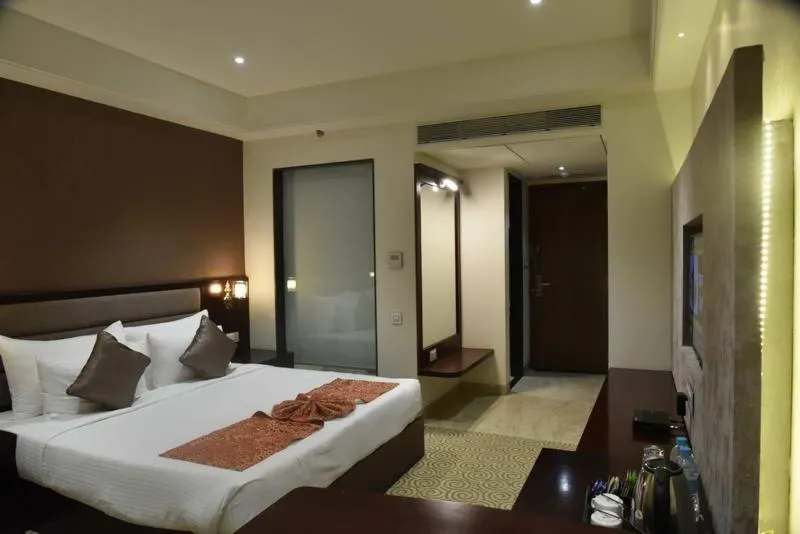 Bed in Pride Hotel & Convention Centre Indore