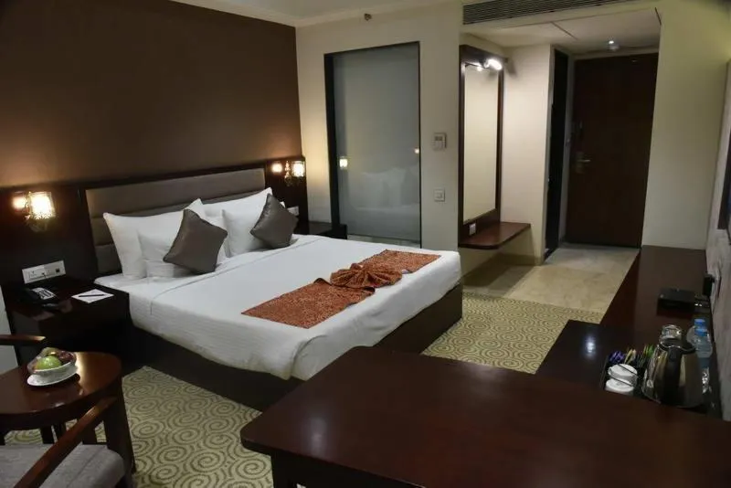 Bed in Pride Hotel & Convention Centre Indore