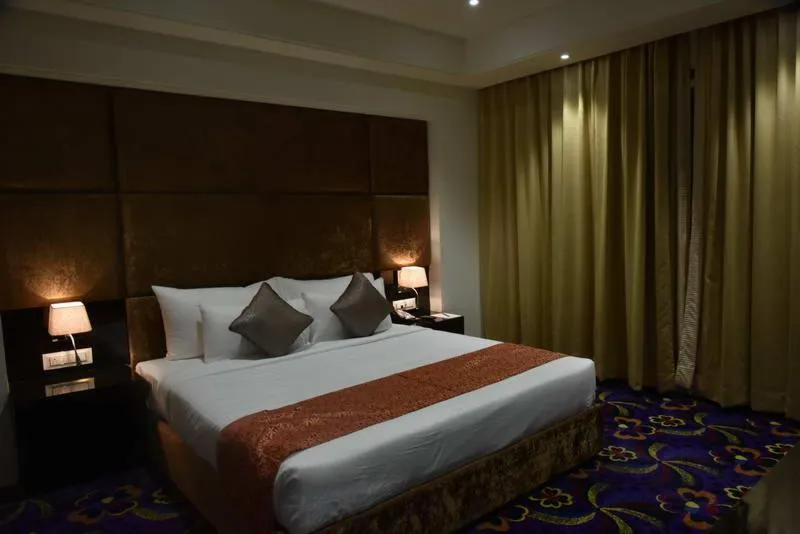 Staff, Bed in Pride Hotel & Convention Centre Indore