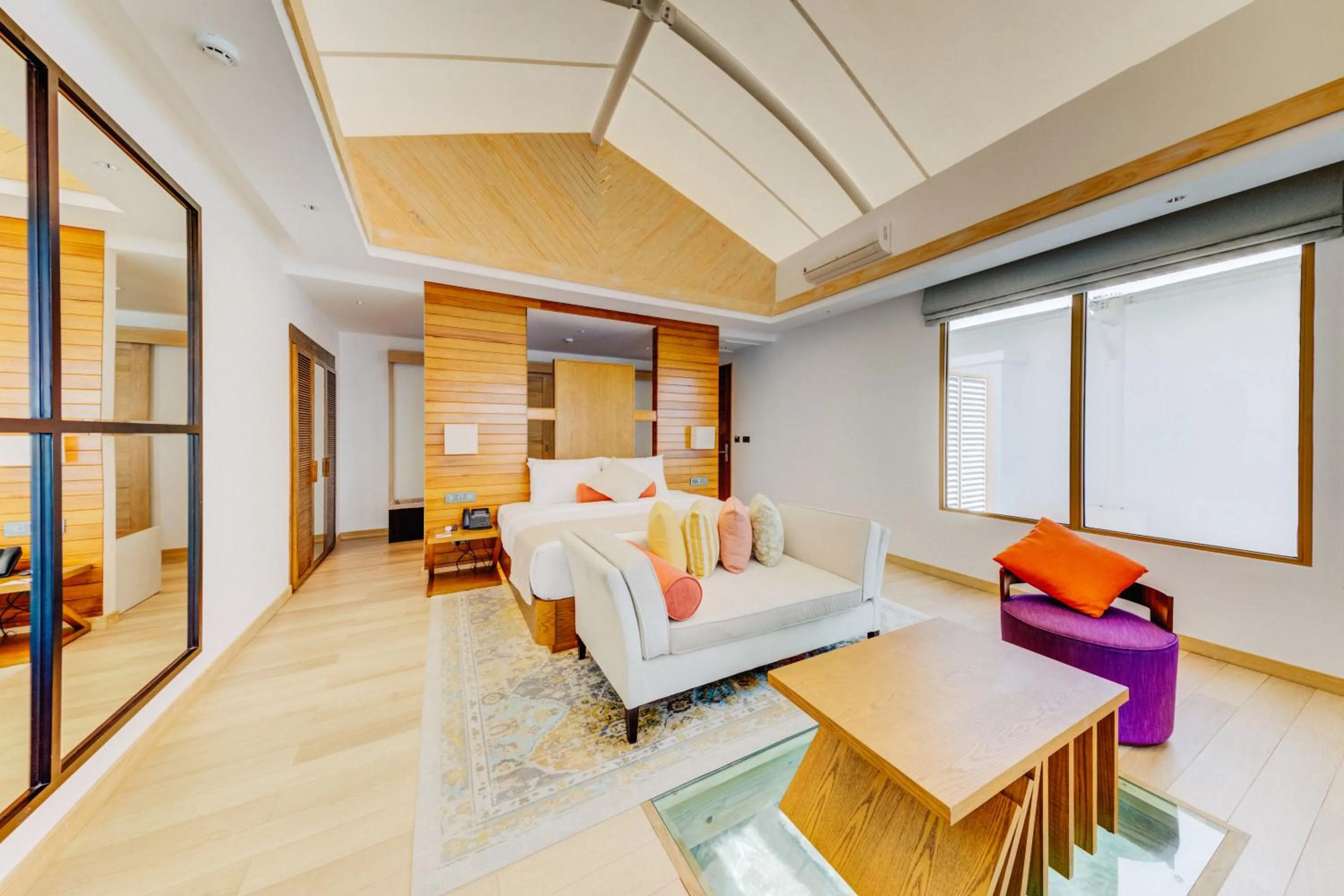 Living room, Bed in Cinnamon Hakuraa Huraa Maldives - Adults-Only