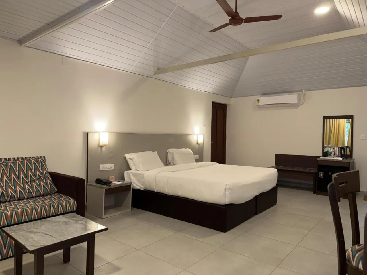 Bed in Abad Harmonia Ayurvedic Beach Resort