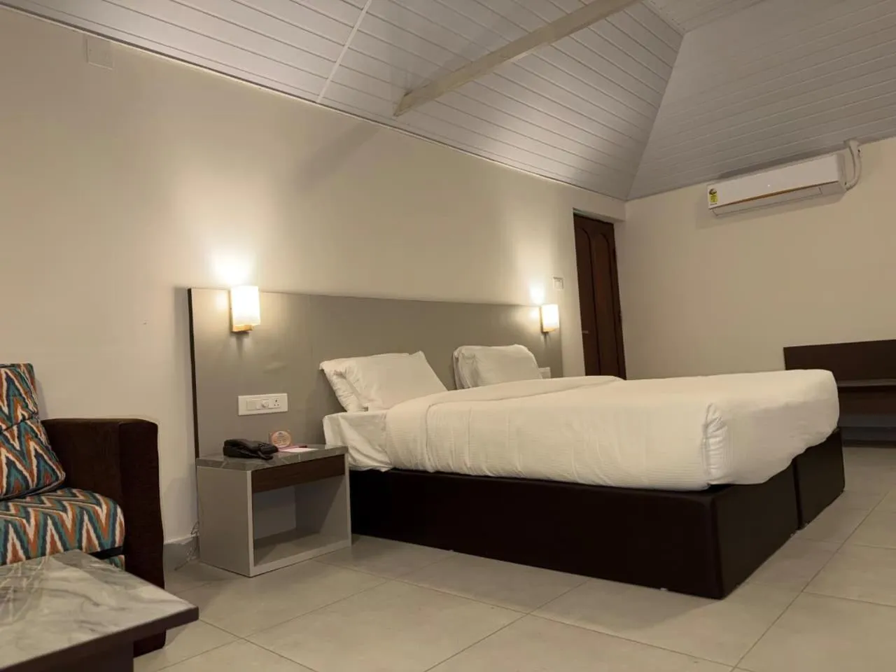 Bed in Abad Harmonia Ayurvedic Beach Resort