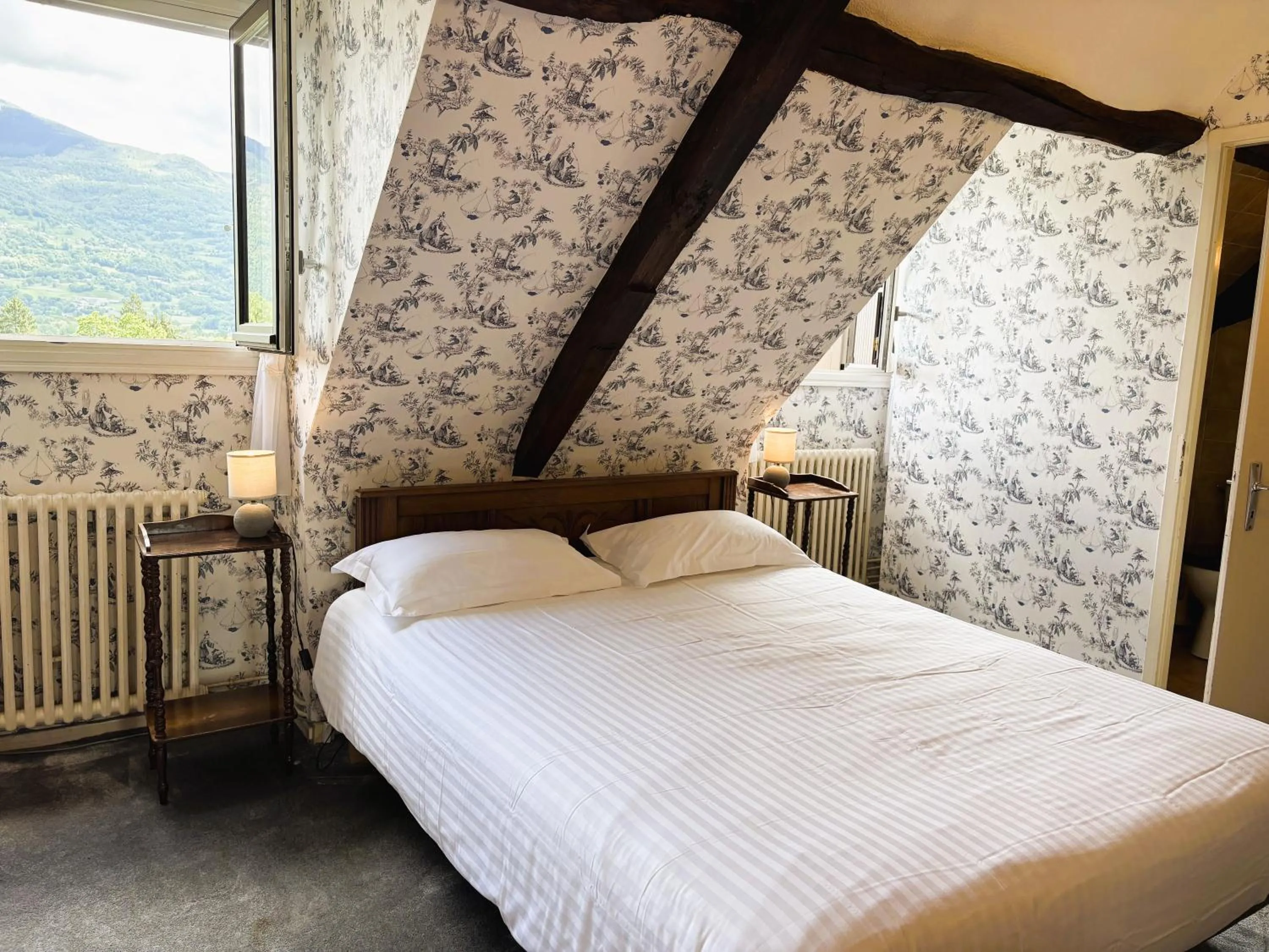 Bed in Logis Hôtel Beau Site