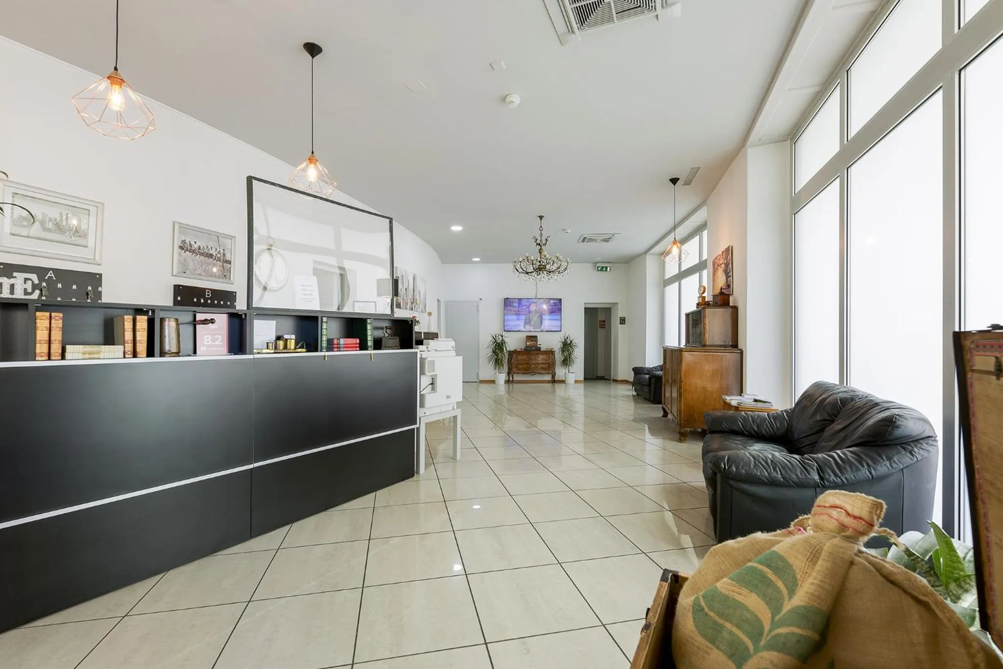 Lobby or reception in GuestHouse Lugano Center by LR