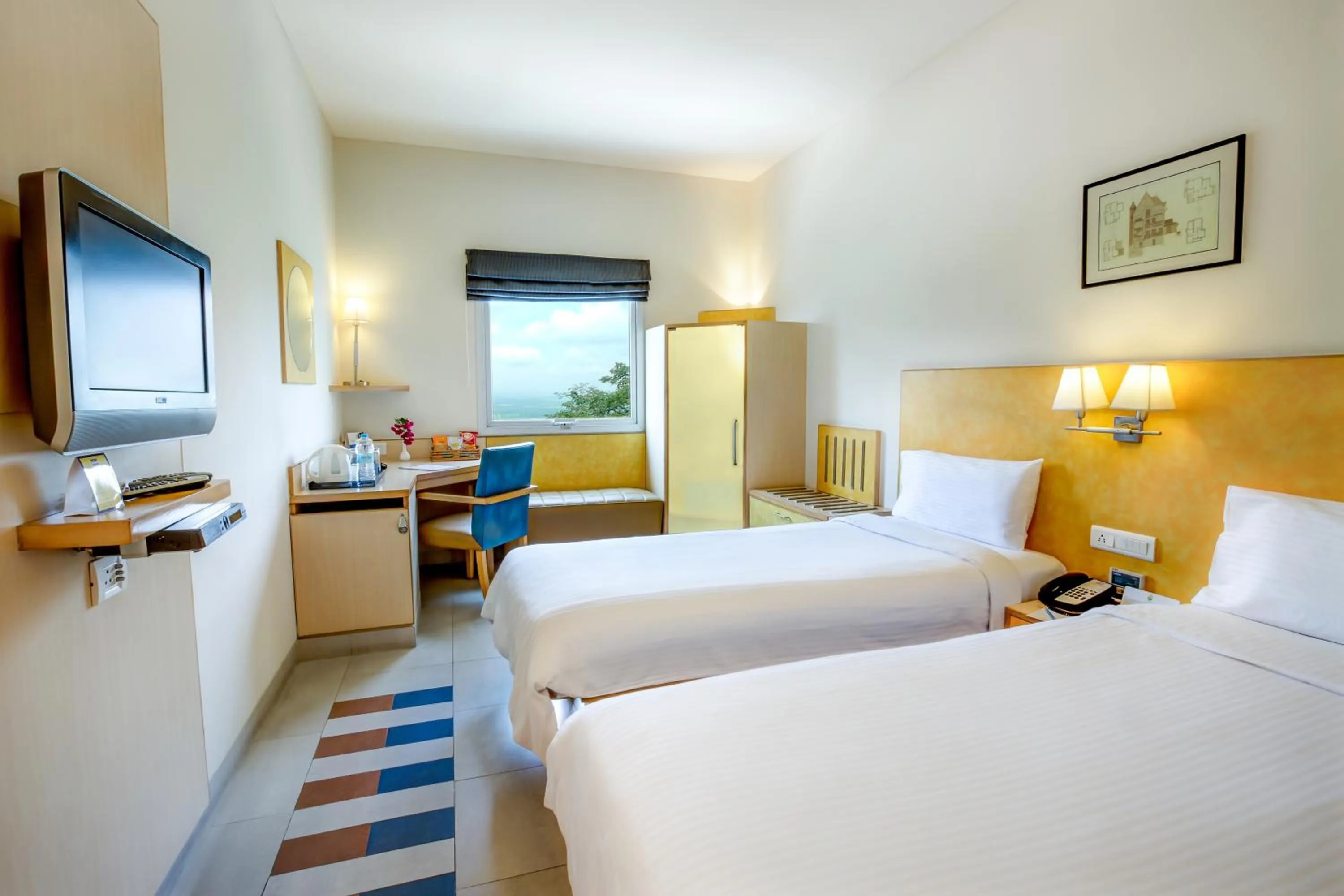 Bed in Radha Hometel