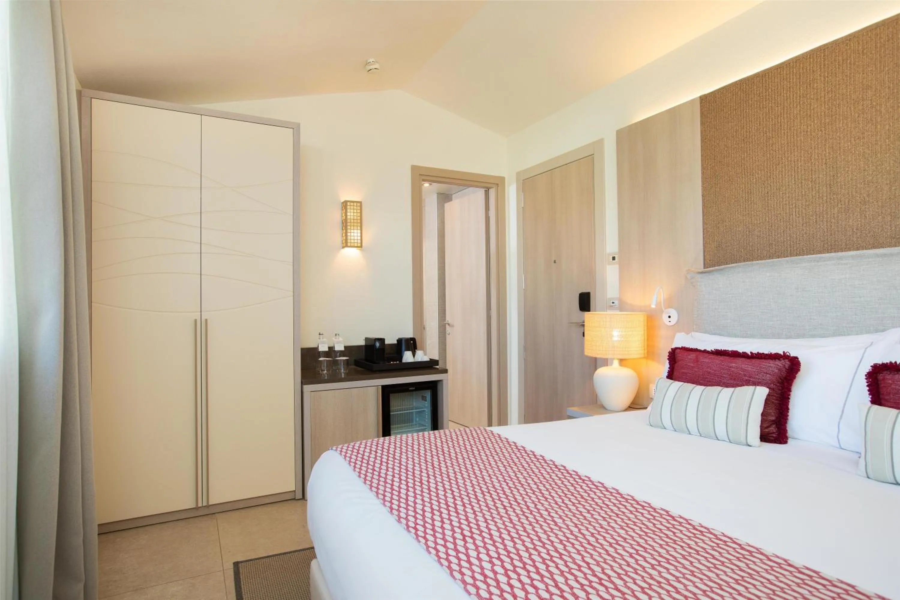 Bed in Mangia's Santa Teresa Sardinia, Curio Collection by Hilton