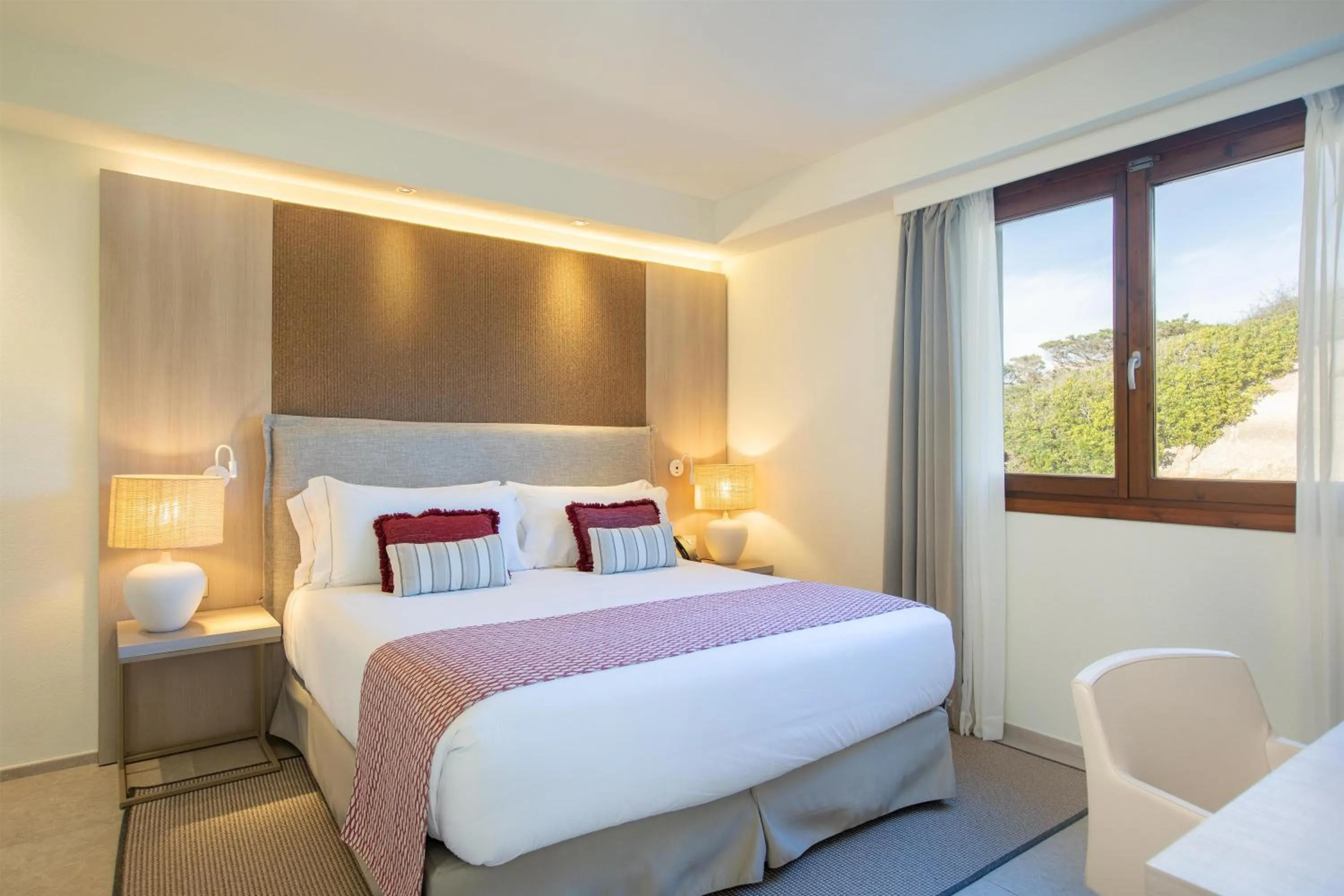 Bed in Mangia's Santa Teresa Sardinia, Curio Collection by Hilton