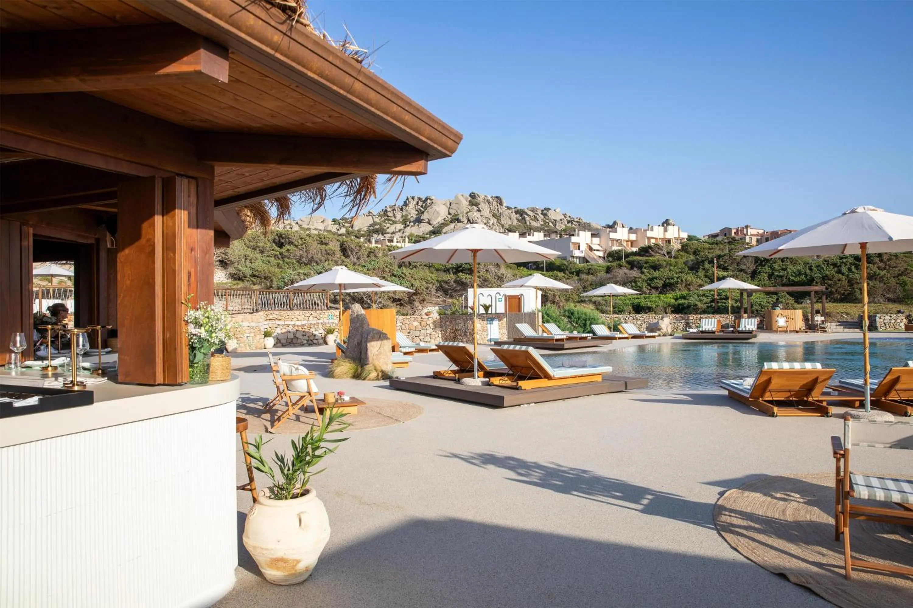Pool view in Mangia's Santa Teresa Sardinia, Curio Collection by Hilton