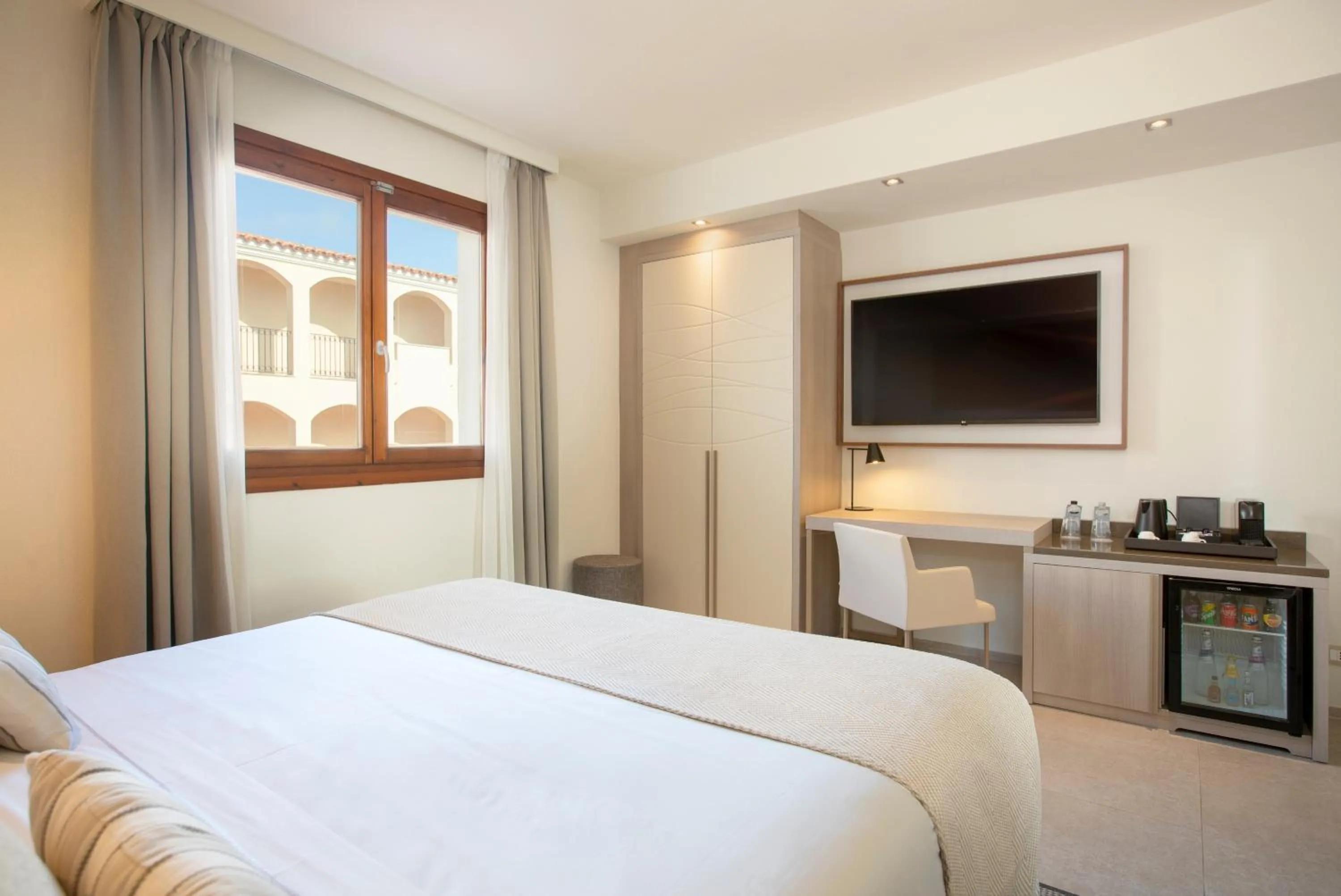 Bed in Mangia's Santa Teresa Sardinia, Curio Collection by Hilton