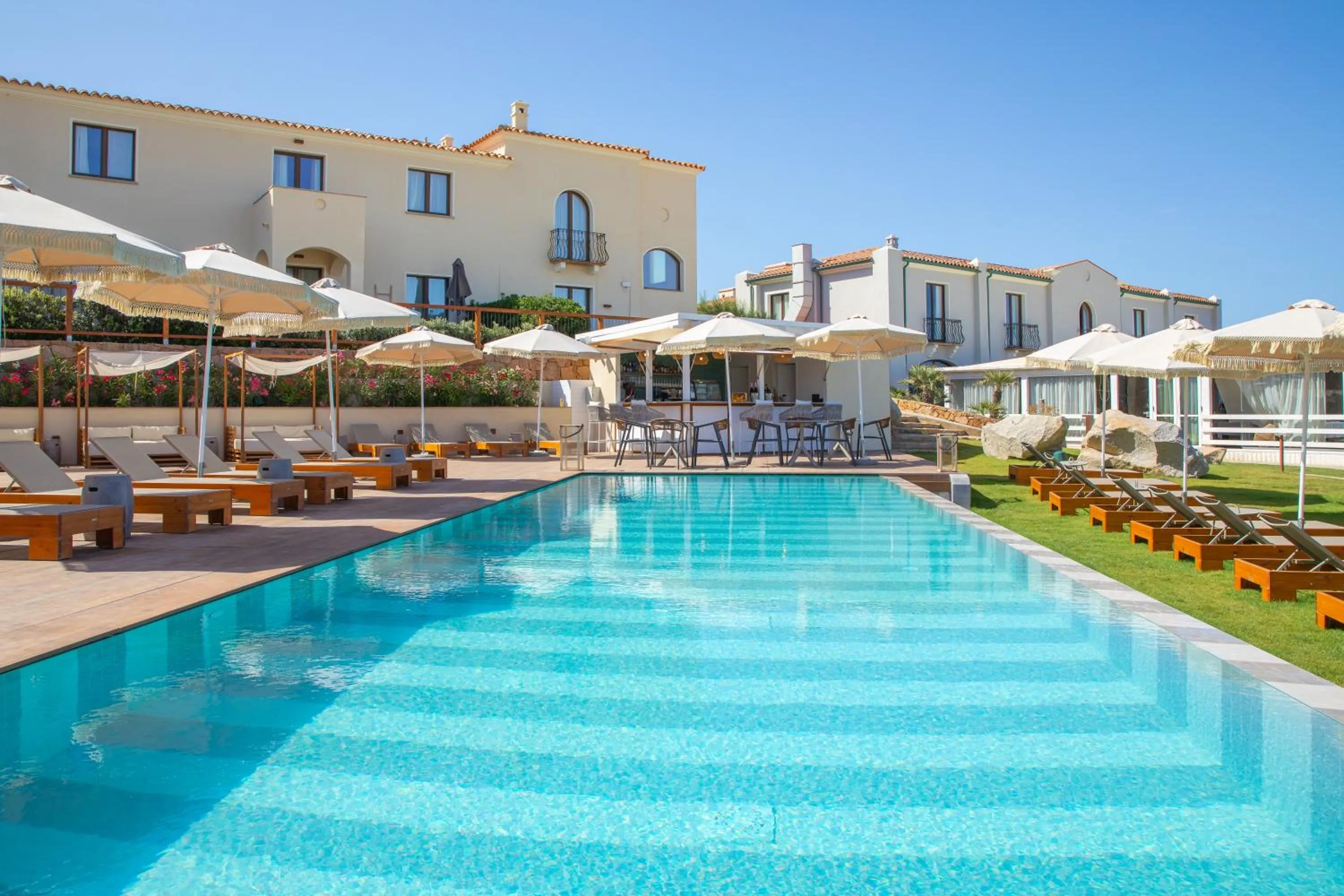 Swimming pool in Mangia's Santa Teresa Sardinia, Curio Collection by Hilton