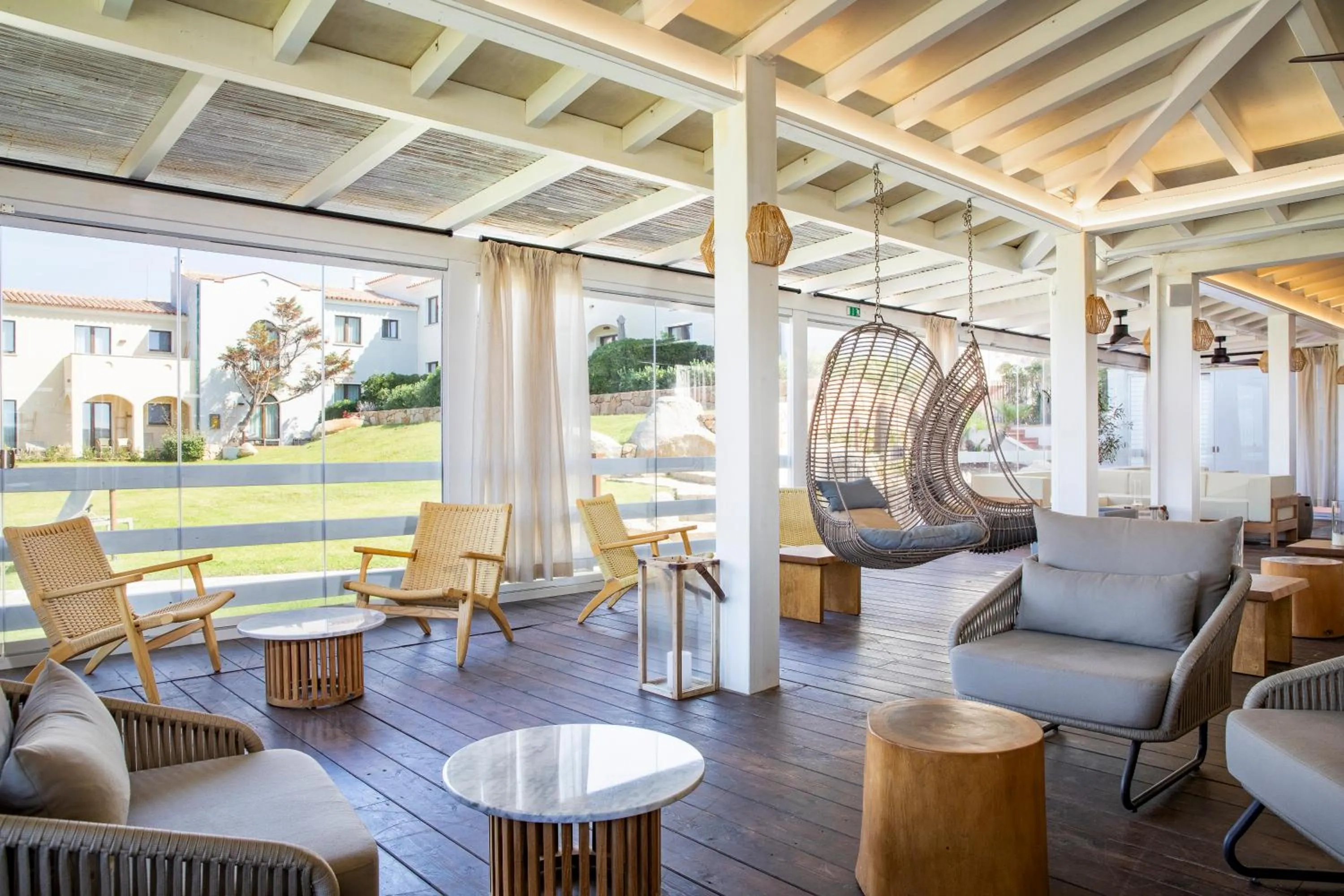 Lounge or bar in Mangia's Santa Teresa Sardinia, Curio Collection by Hilton