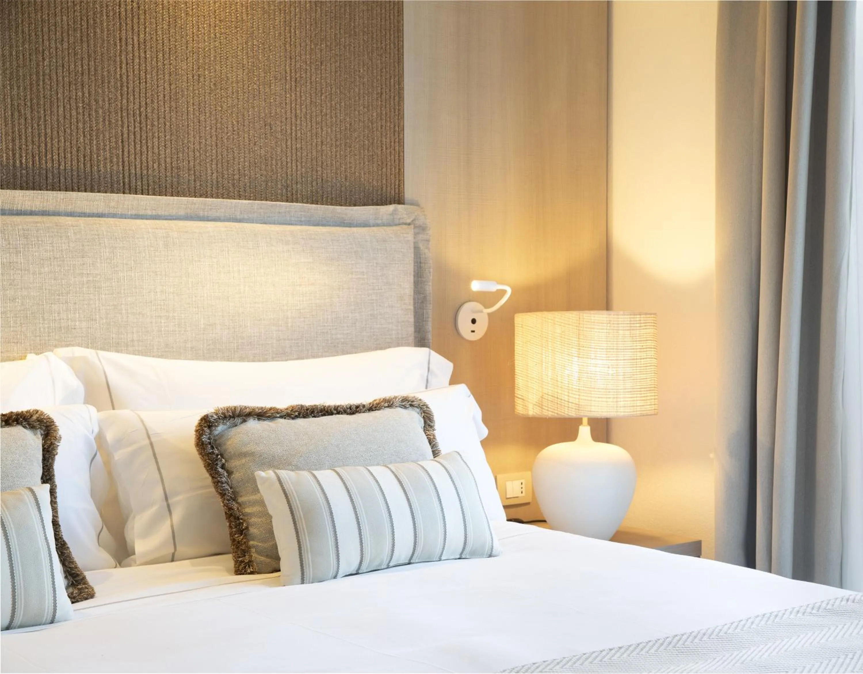 Bed in Mangia's Santa Teresa Sardinia, Curio Collection by Hilton