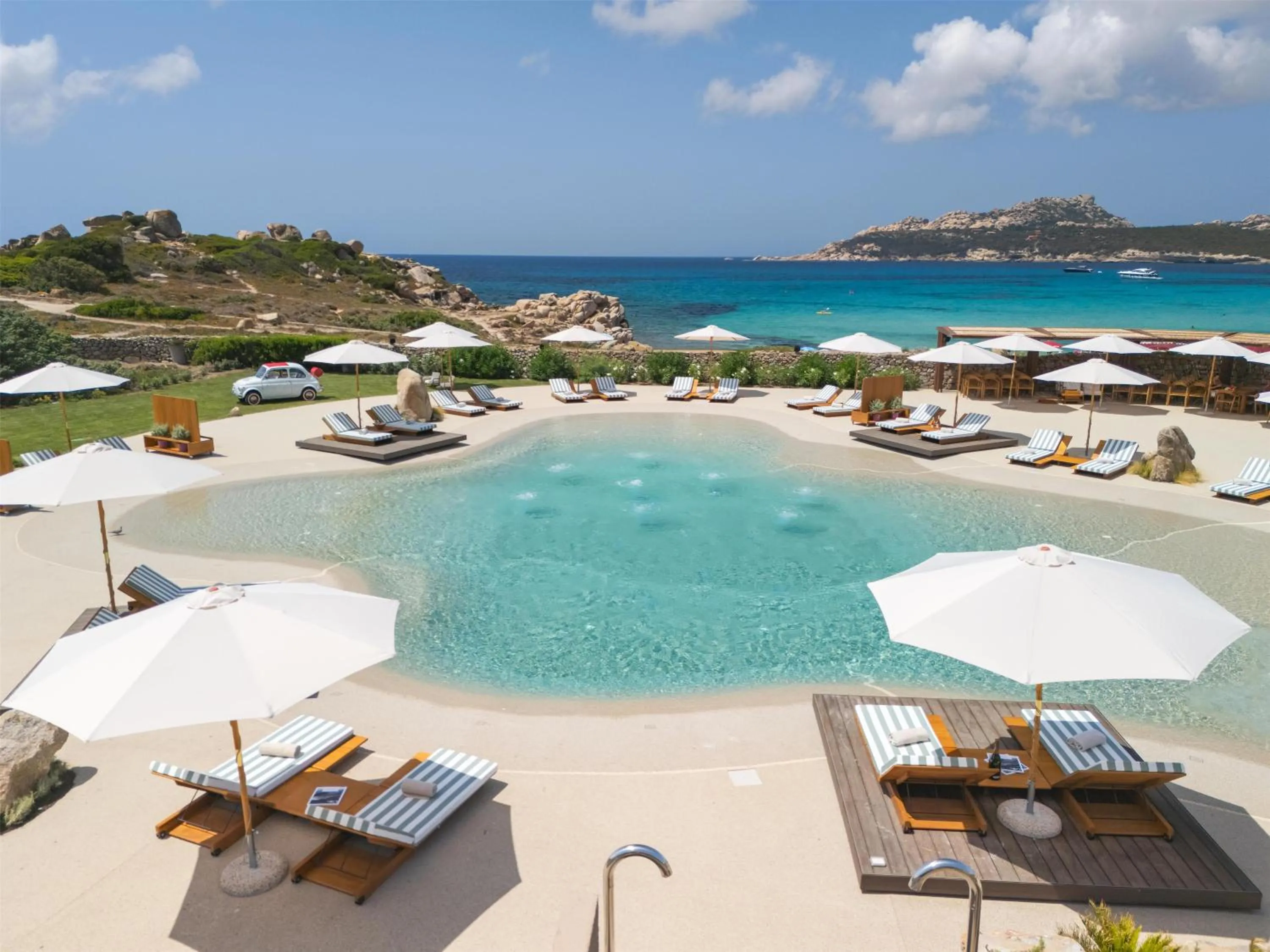 Pool view in Mangia's Santa Teresa Sardinia, Curio Collection by Hilton