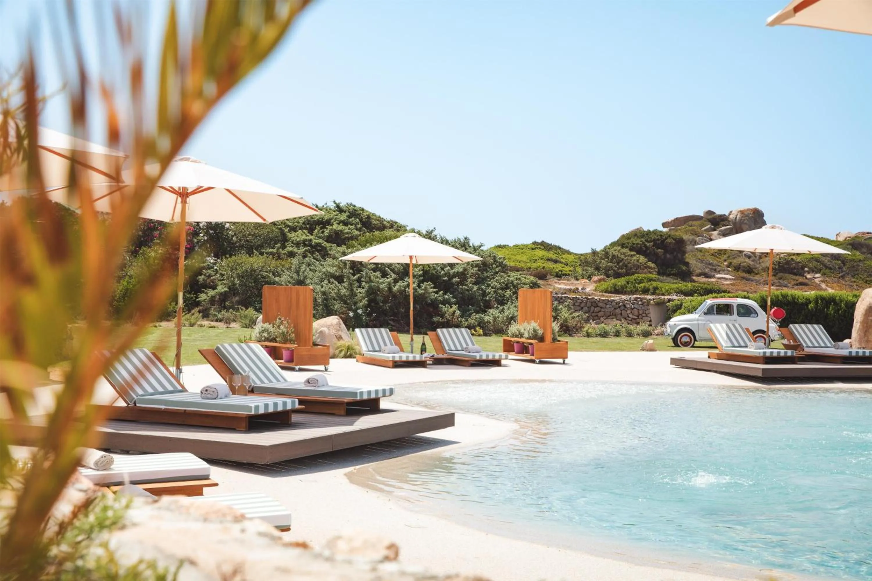 Pool view in Mangia's Santa Teresa Sardinia, Curio Collection by Hilton