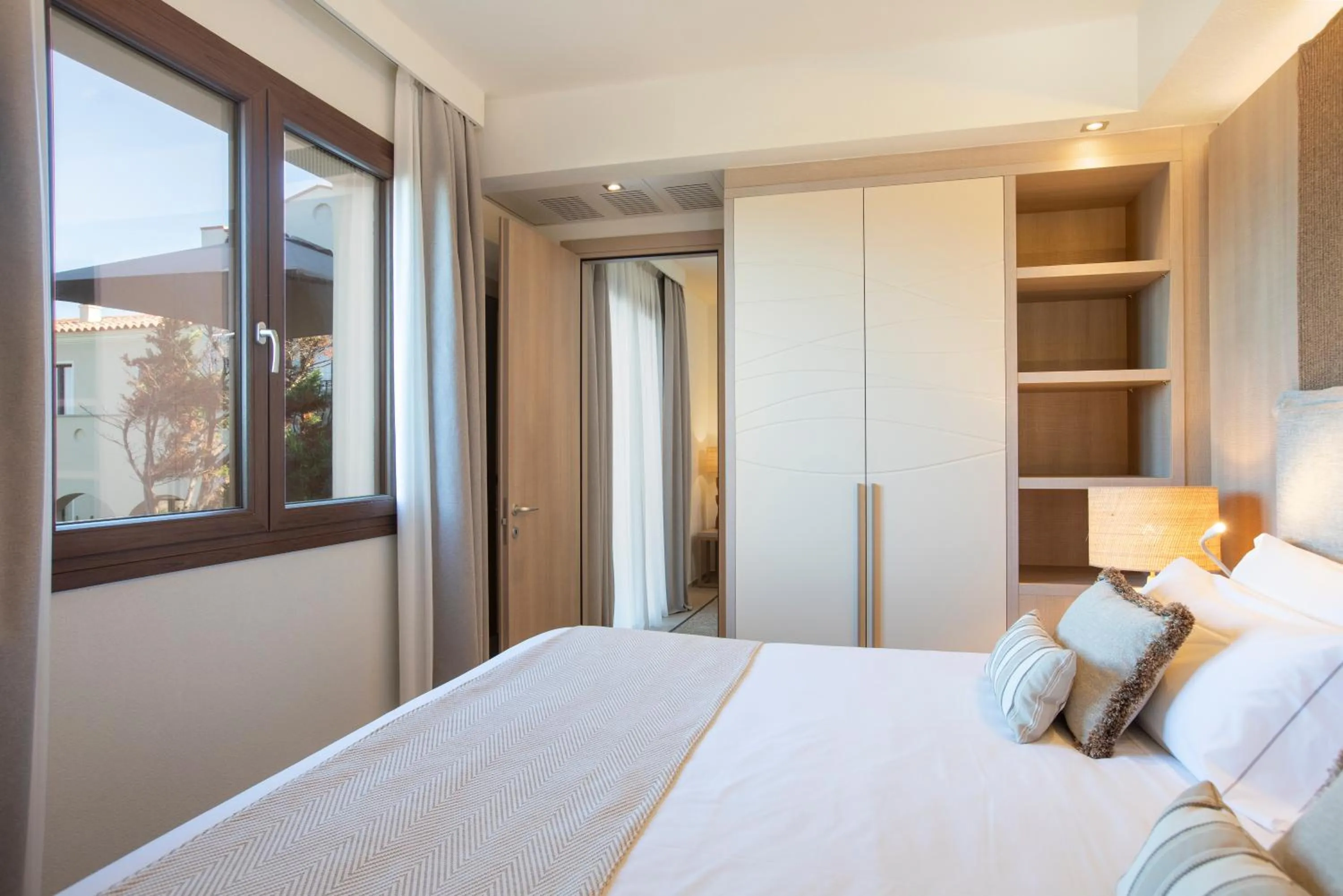 Bed in Mangia's Santa Teresa Sardinia, Curio Collection by Hilton