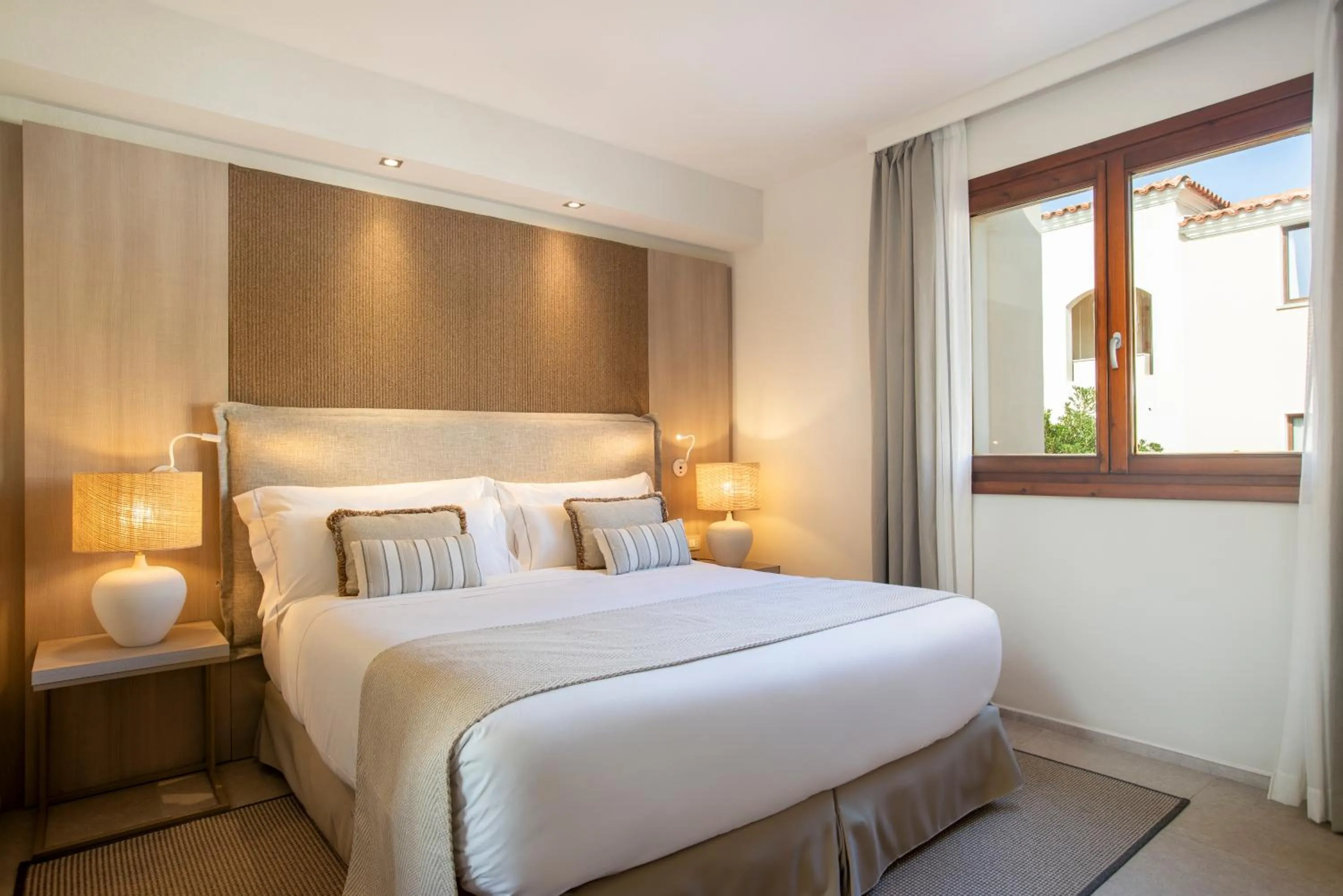 Bed in Mangia's Santa Teresa Sardinia, Curio Collection by Hilton