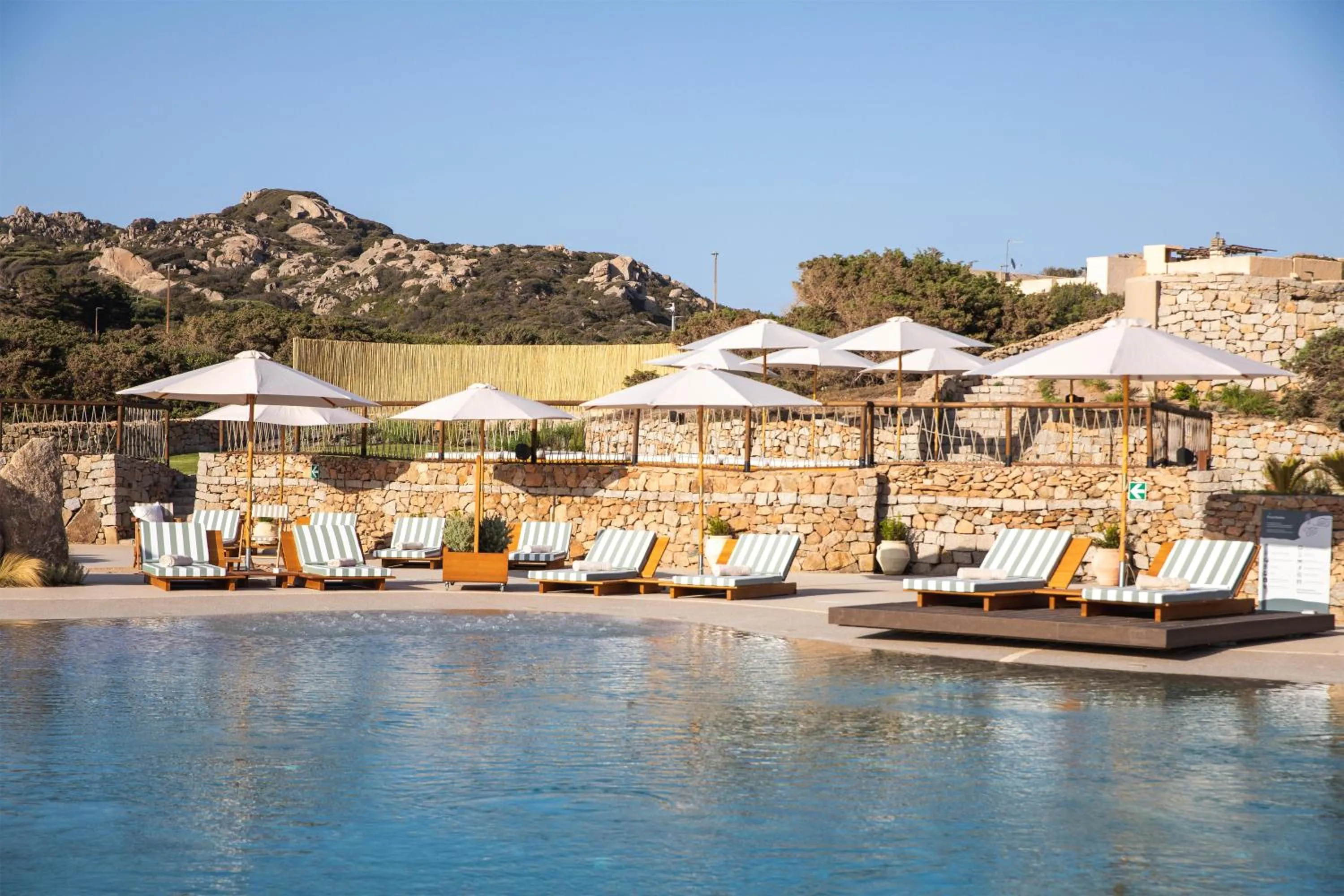 Pool view in Mangia's Santa Teresa Sardinia, Curio Collection by Hilton