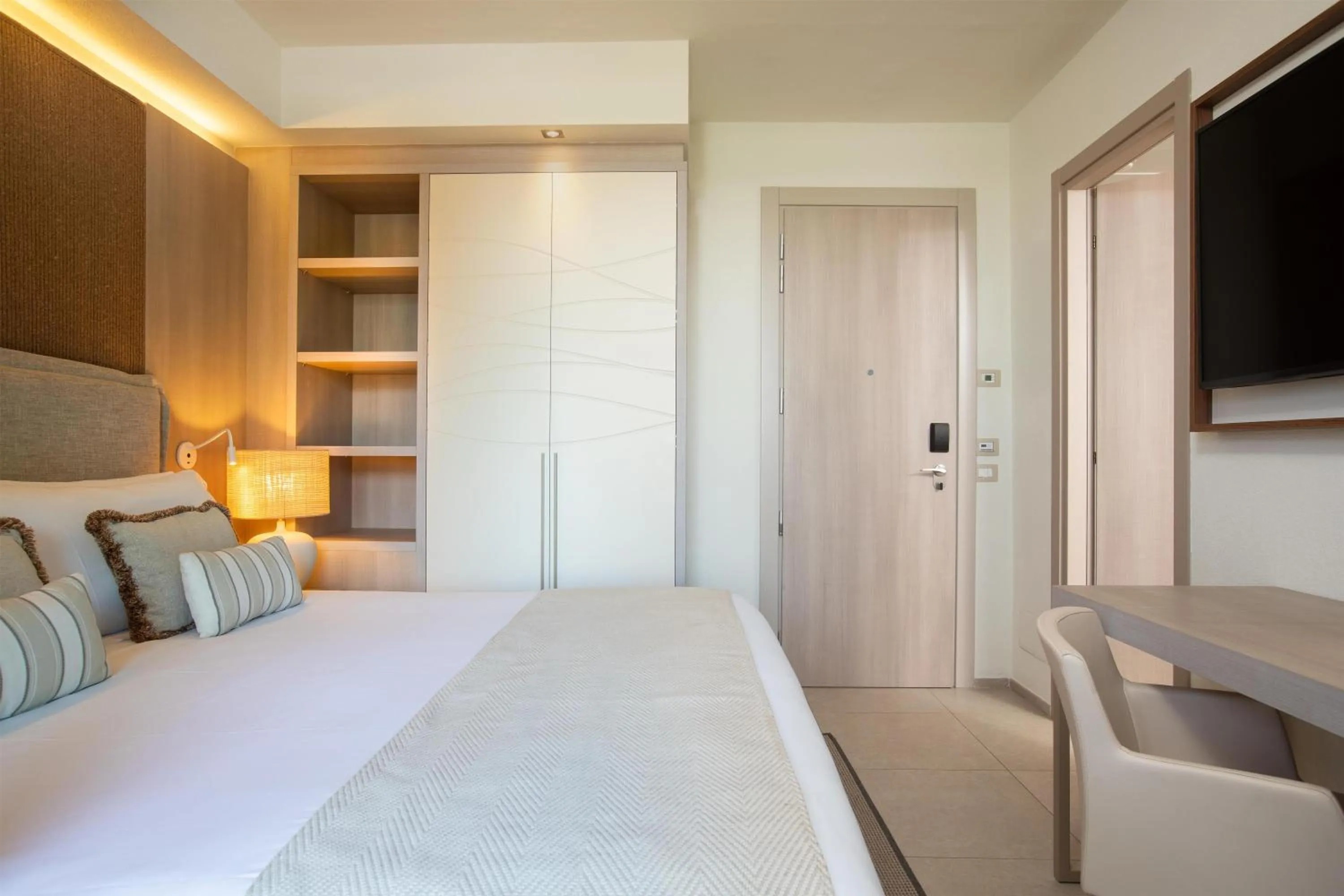 Bed in Mangia's Santa Teresa Sardinia, Curio Collection by Hilton