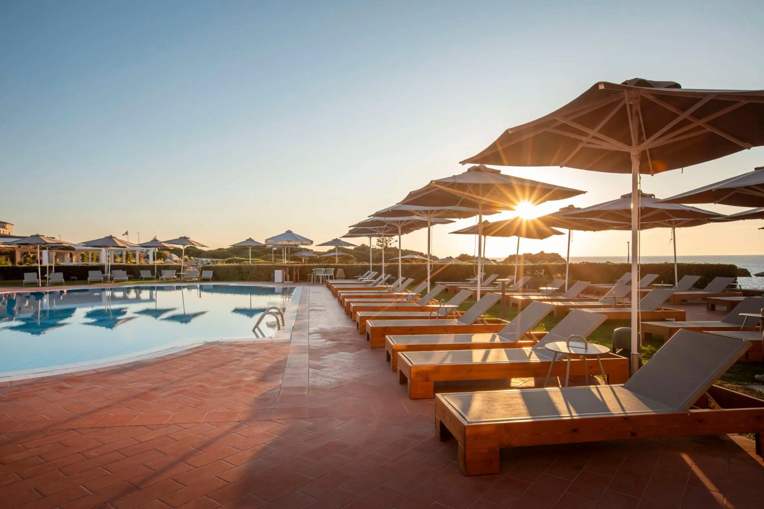 Pool view in Mangia's Santa Teresa Sardinia, Curio Collection by Hilton