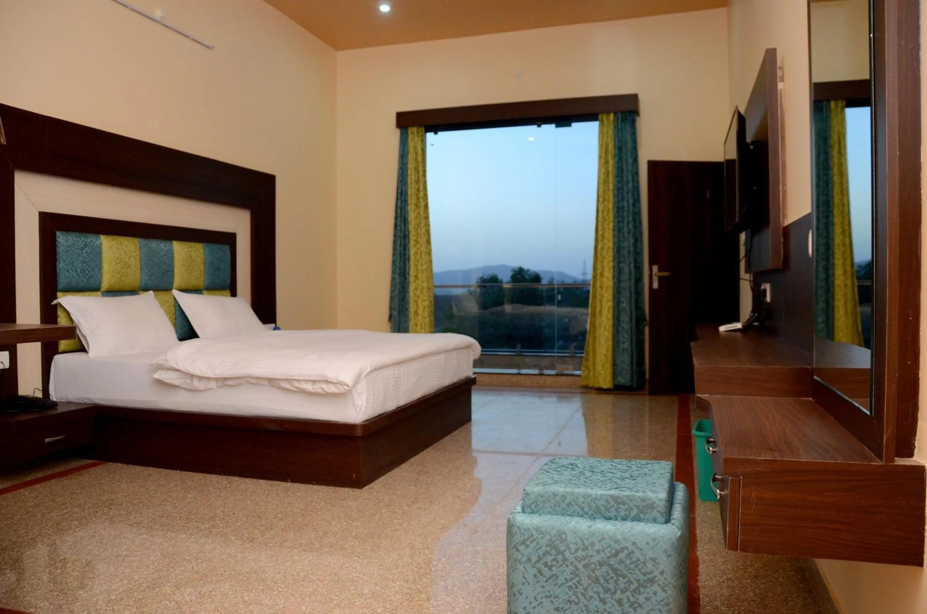 Bedroom in Chitrakoot Garden and Resorts