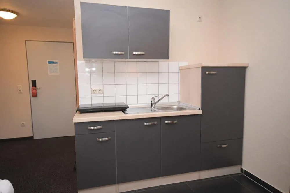 Kitchen or kitchenette in Gästehaus Bavaria