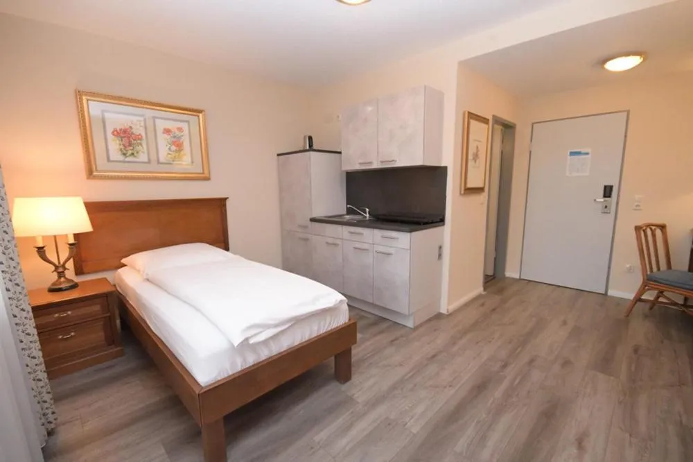 Kitchen or kitchenette, Bed in Gästehaus Bavaria