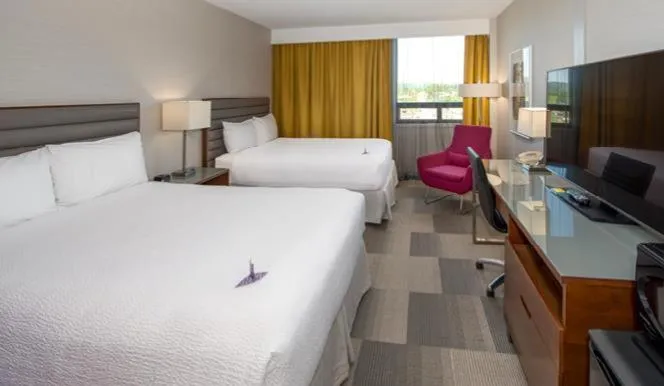 Bed in Coast Prince George Hotel by APA