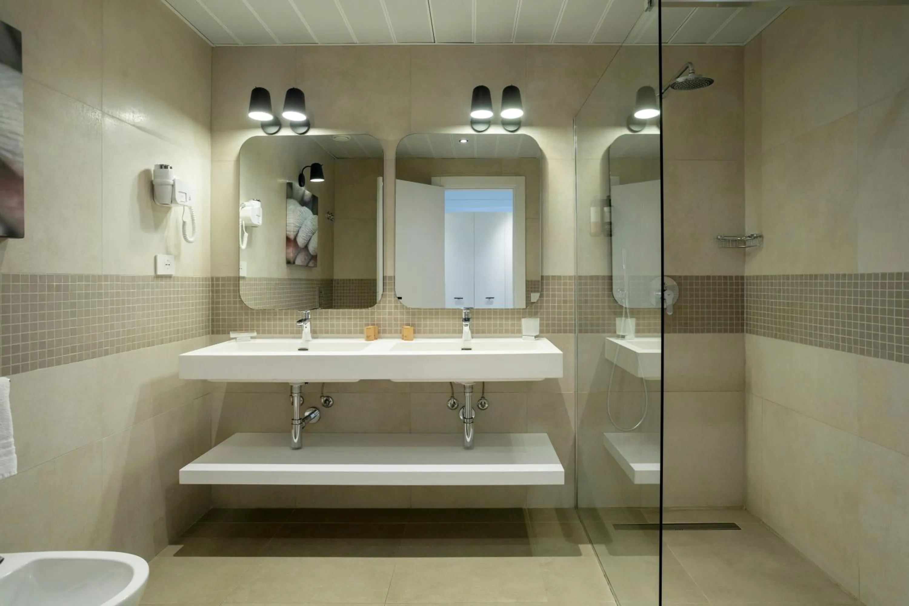 Bathroom in Mangia's Torre Del Barone Resort & SPA