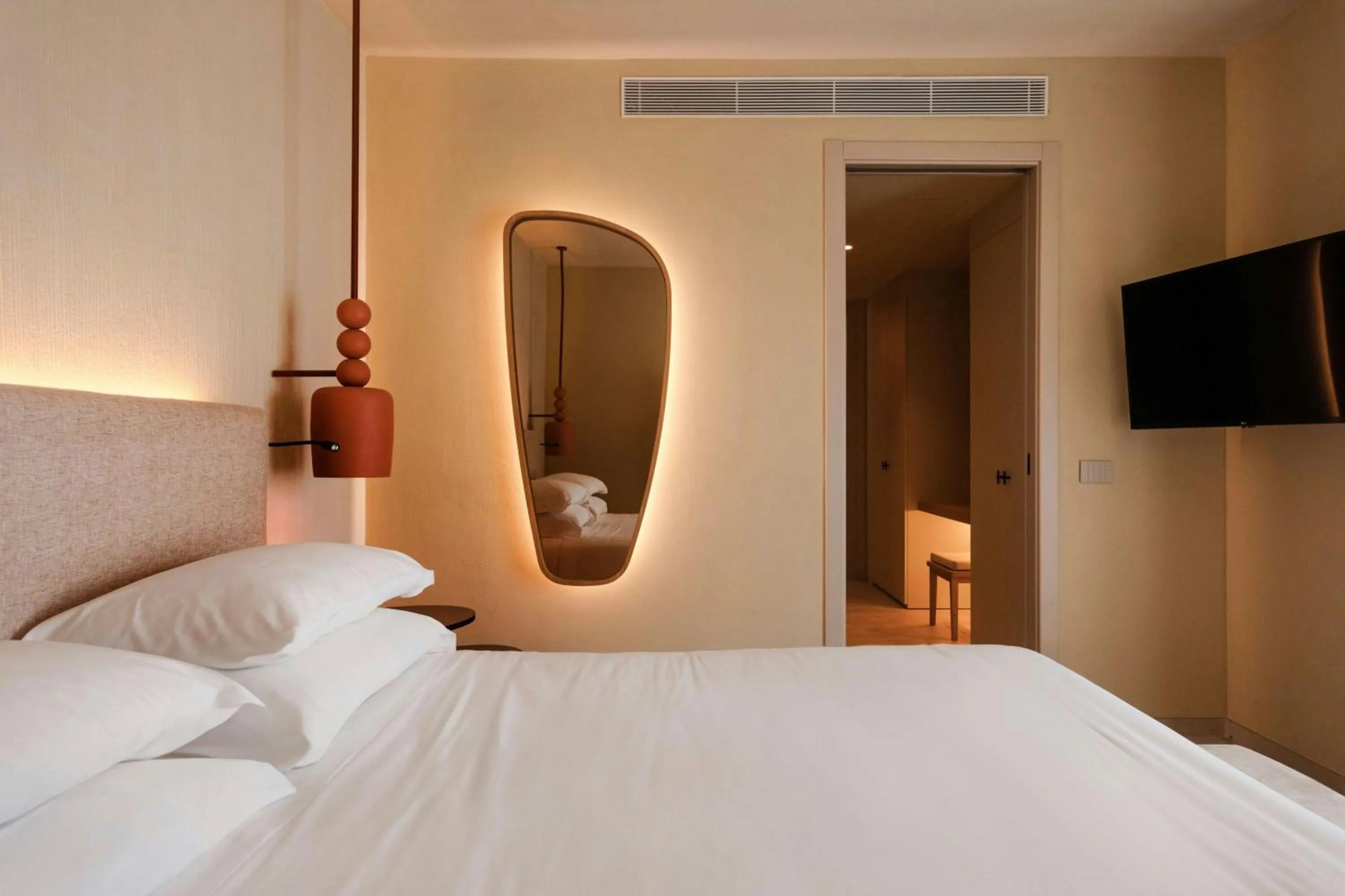 Photo of the whole room, Bed in Mangia's Brucoli, Sicily, Autograph Collection