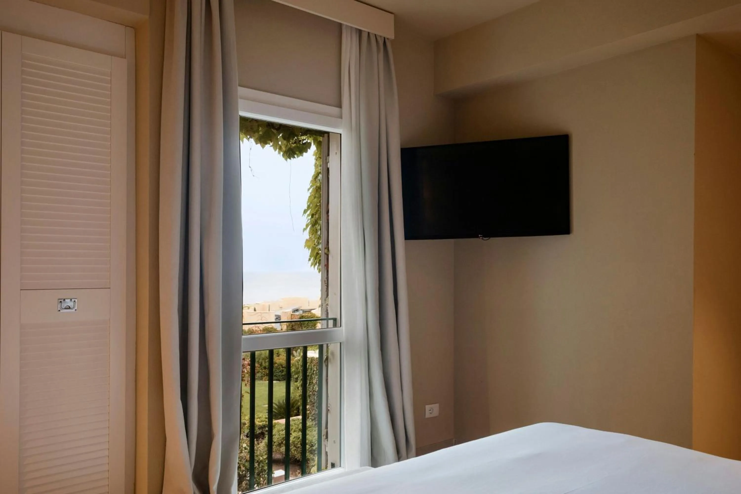 Photo of the whole room, Bed in Mangia's Brucoli, Sicily, Autograph Collection