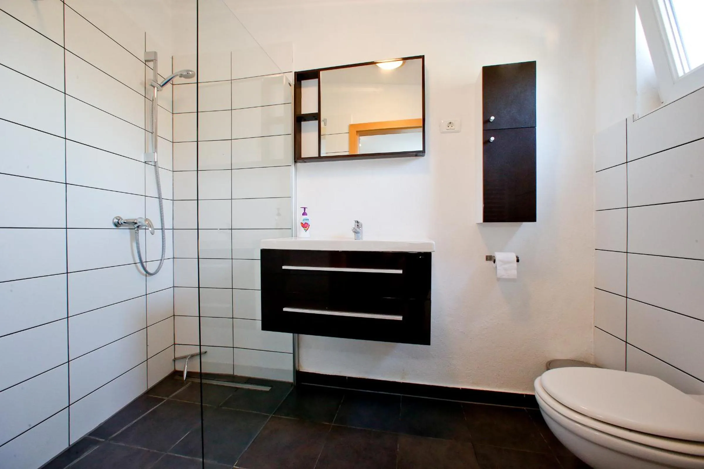 Bathroom in BC Better Choice Apartments with Central Heating