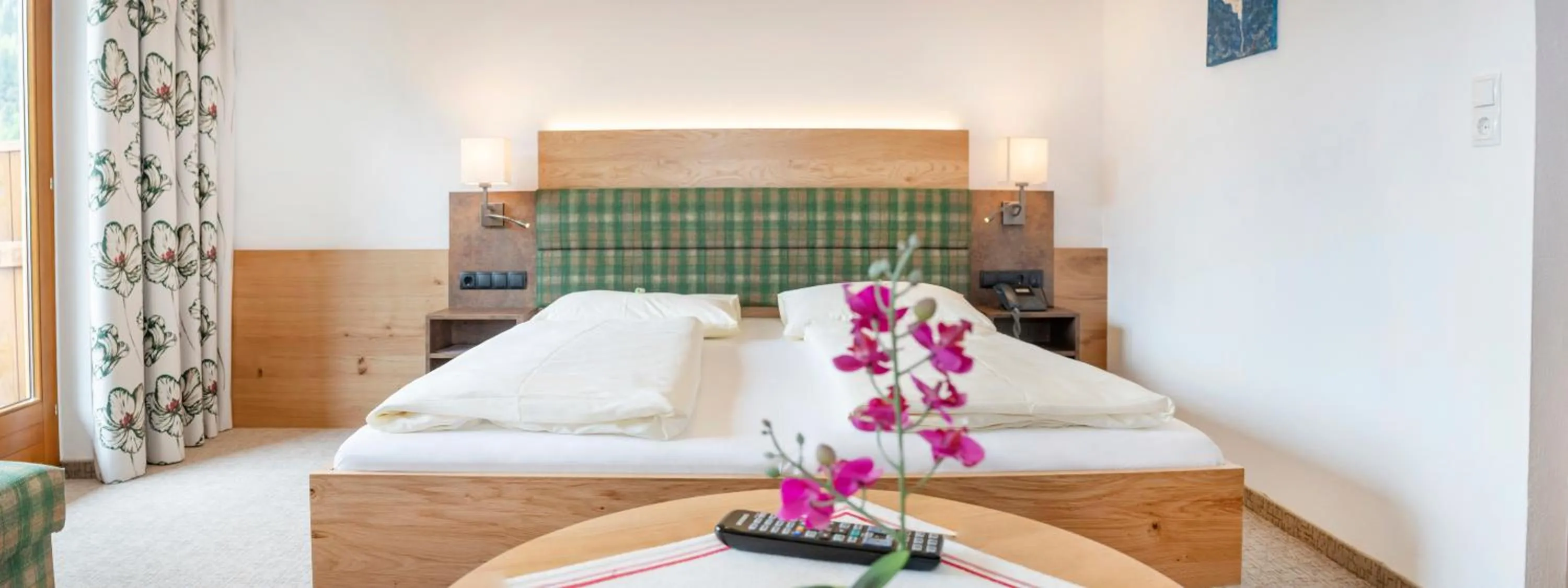 Photo of the whole room, Bed in Landhotel Tirolerhof - Wildschönau - PREMIUM Card im Sommer