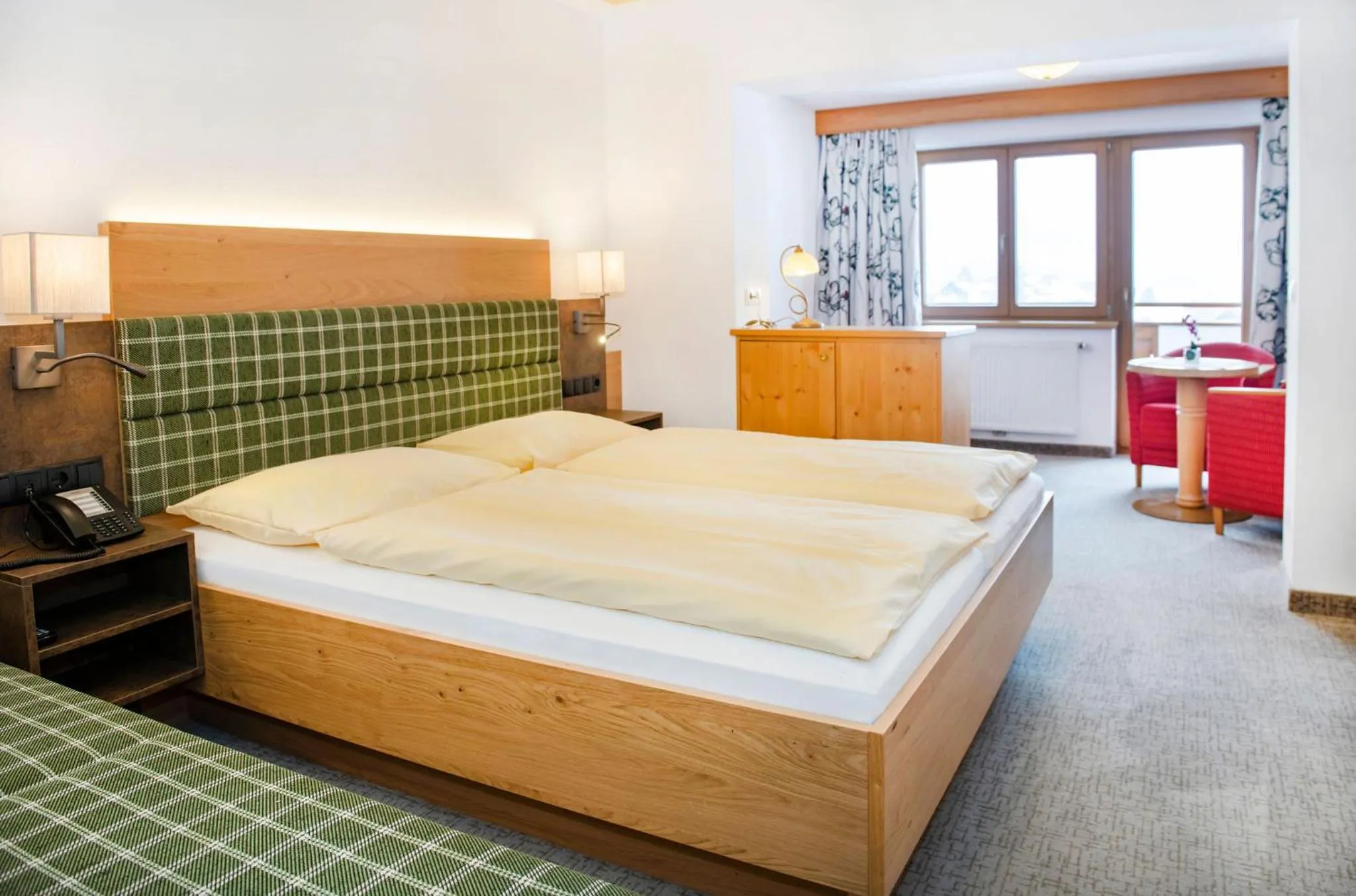 Photo of the whole room, Bed in Landhotel Tirolerhof - Wildschönau - PREMIUM Card im Sommer