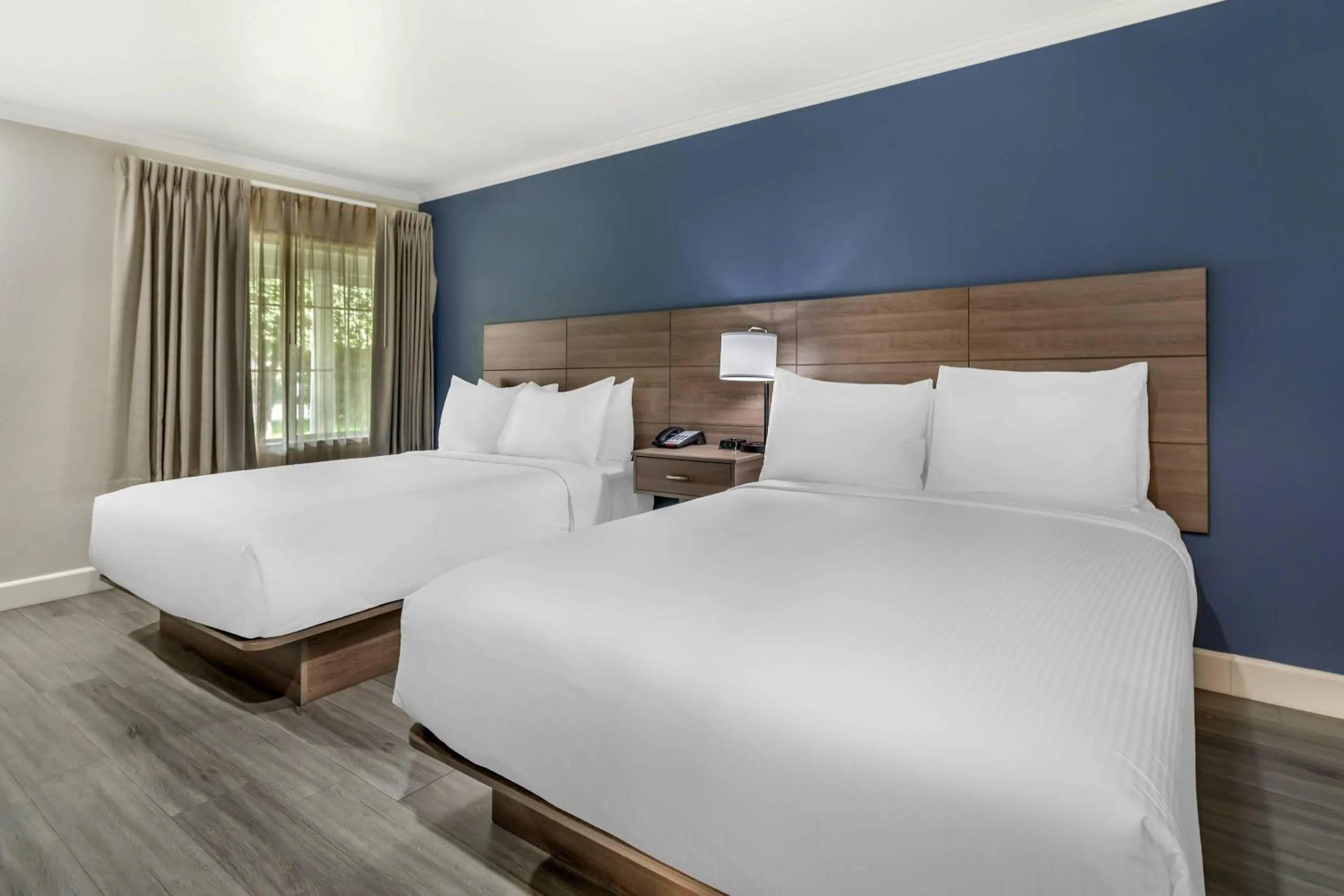 Bedroom, Bed in University Park Inn & Suites, an Ascend Collection Hotel