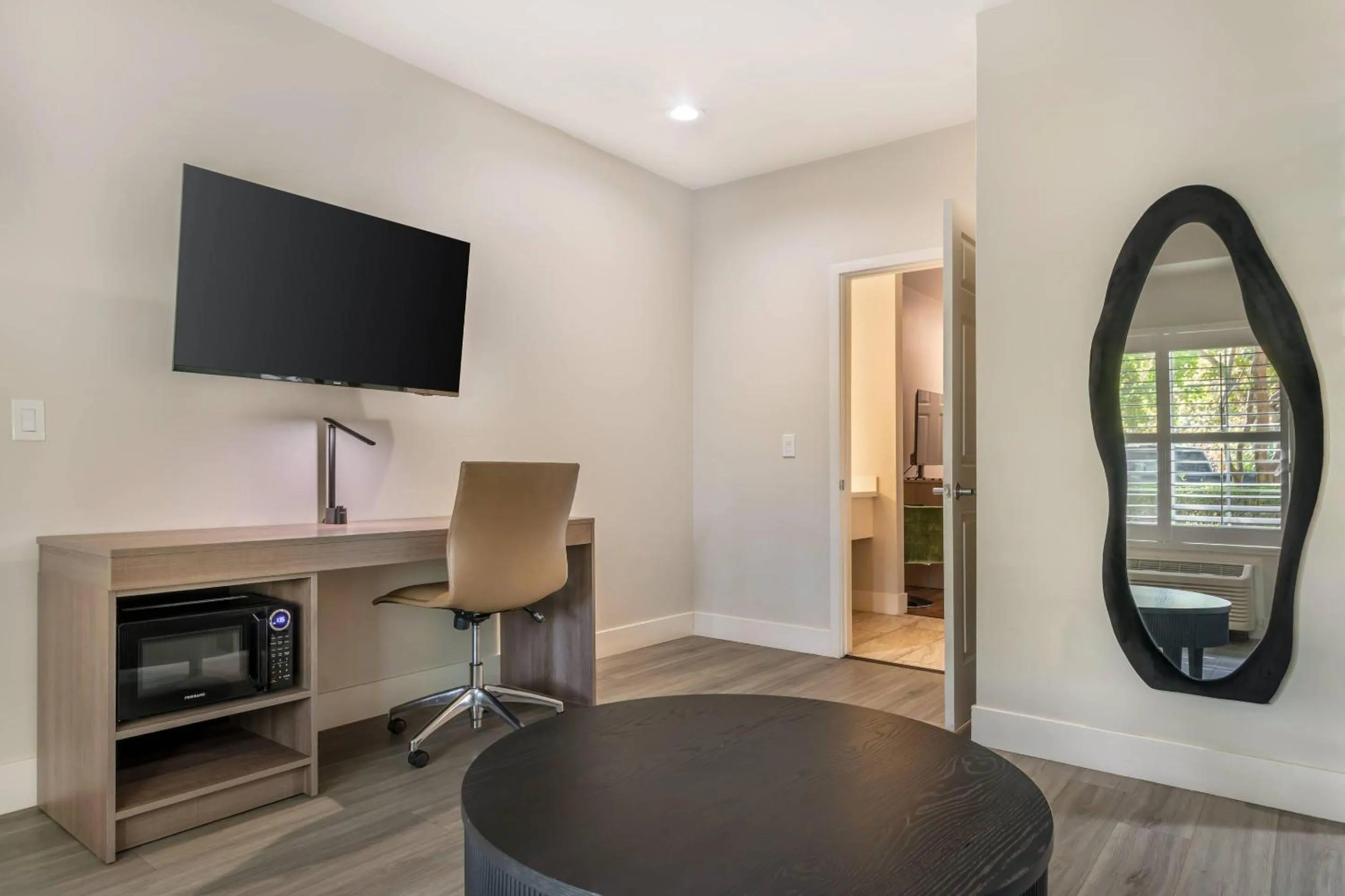 Bedroom in University Park Inn & Suites, an Ascend Collection Hotel