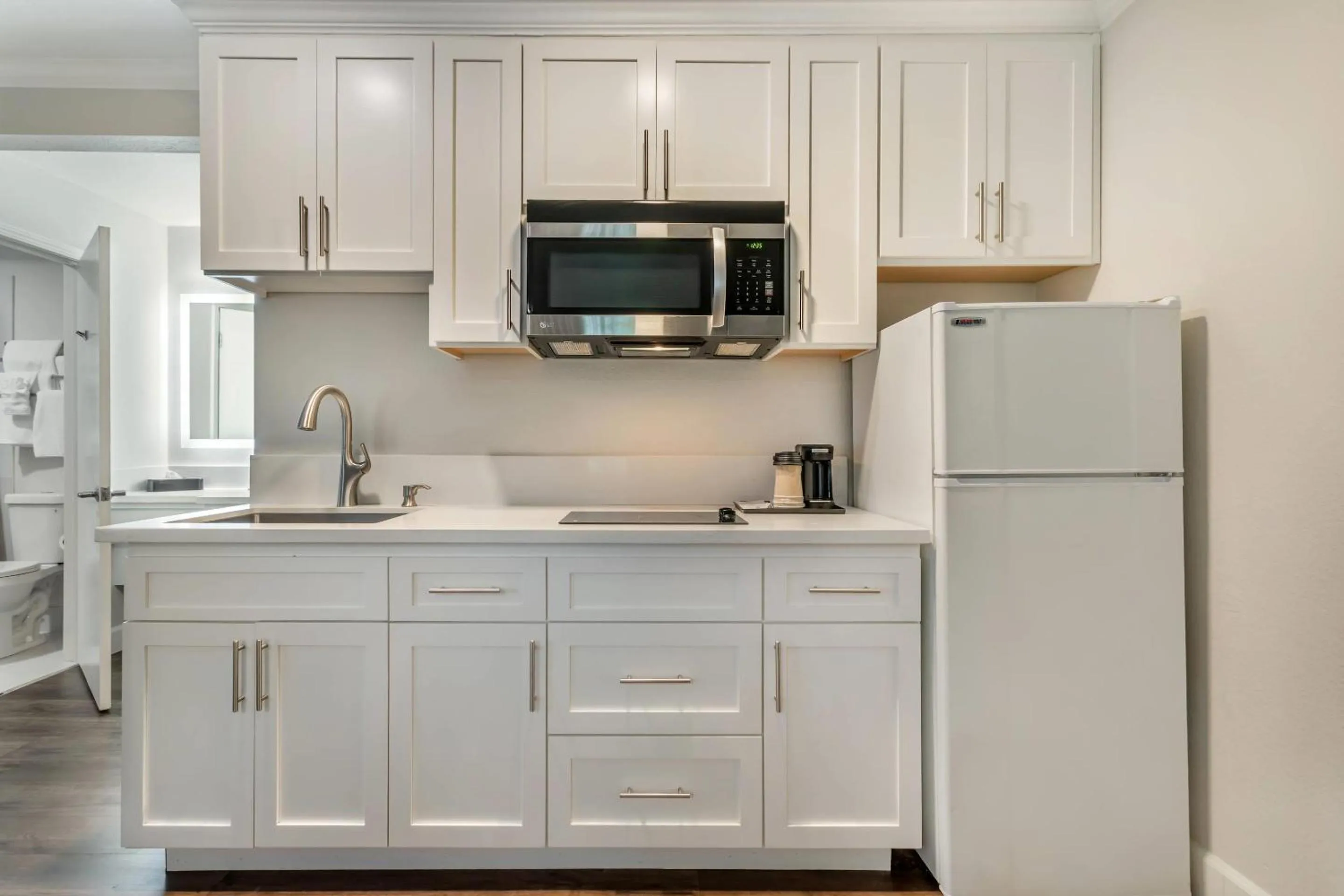 Bedroom in University Park Inn & Suites, an Ascend Collection Hotel