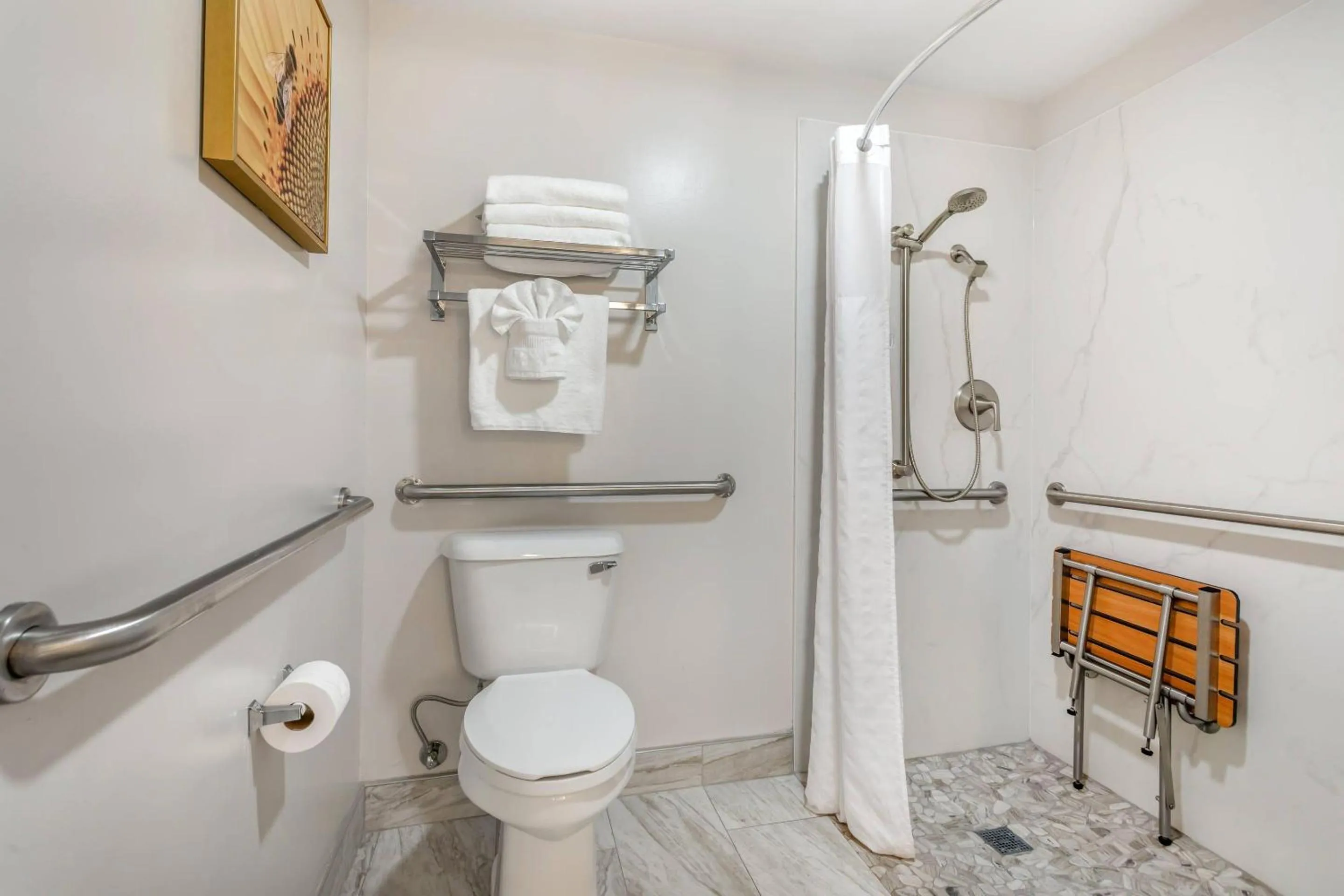 Bedroom in University Park Inn & Suites, an Ascend Collection Hotel