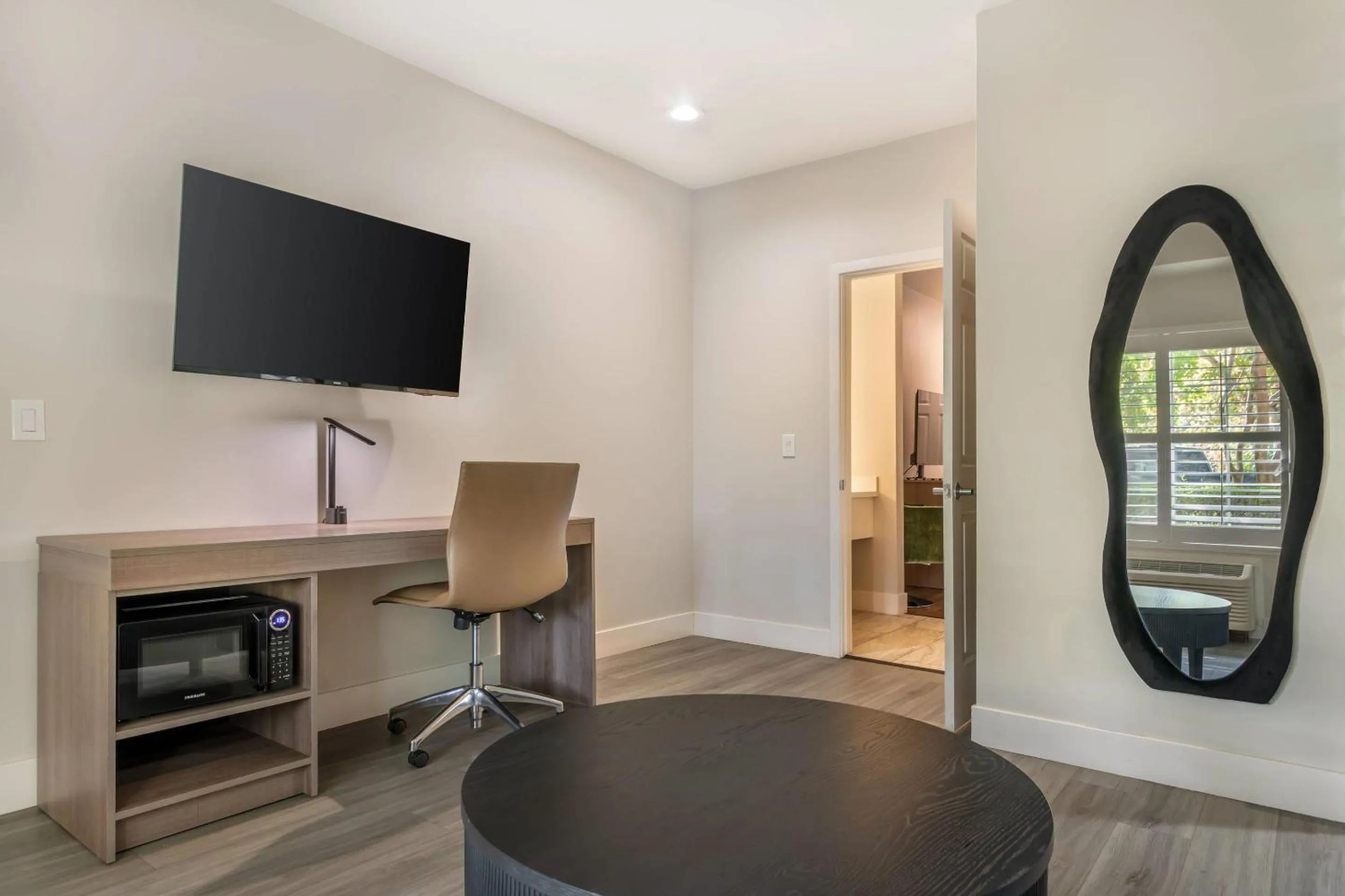 Bedroom in University Park Inn & Suites, an Ascend Collection Hotel