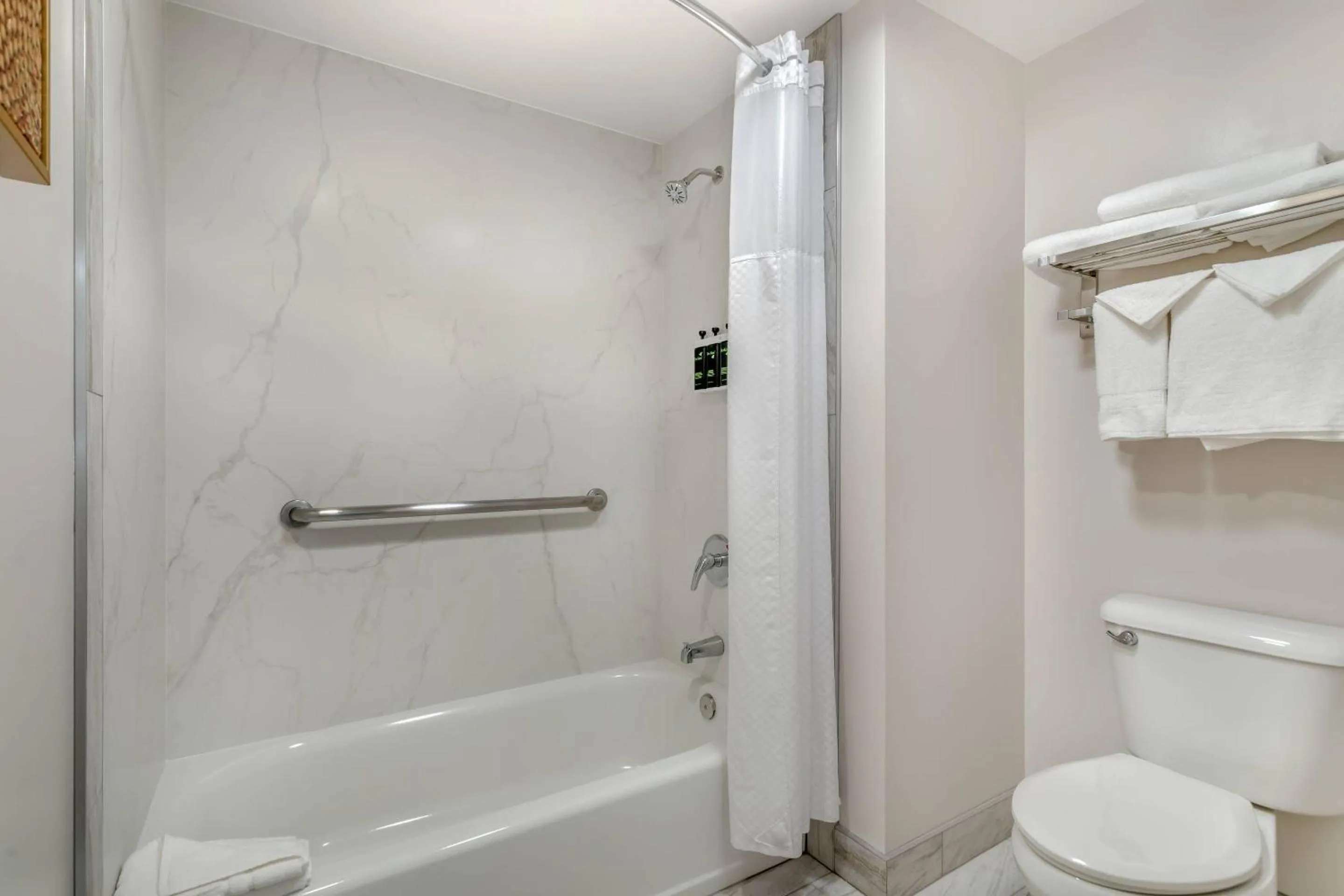 Bedroom in University Park Inn & Suites, an Ascend Collection Hotel