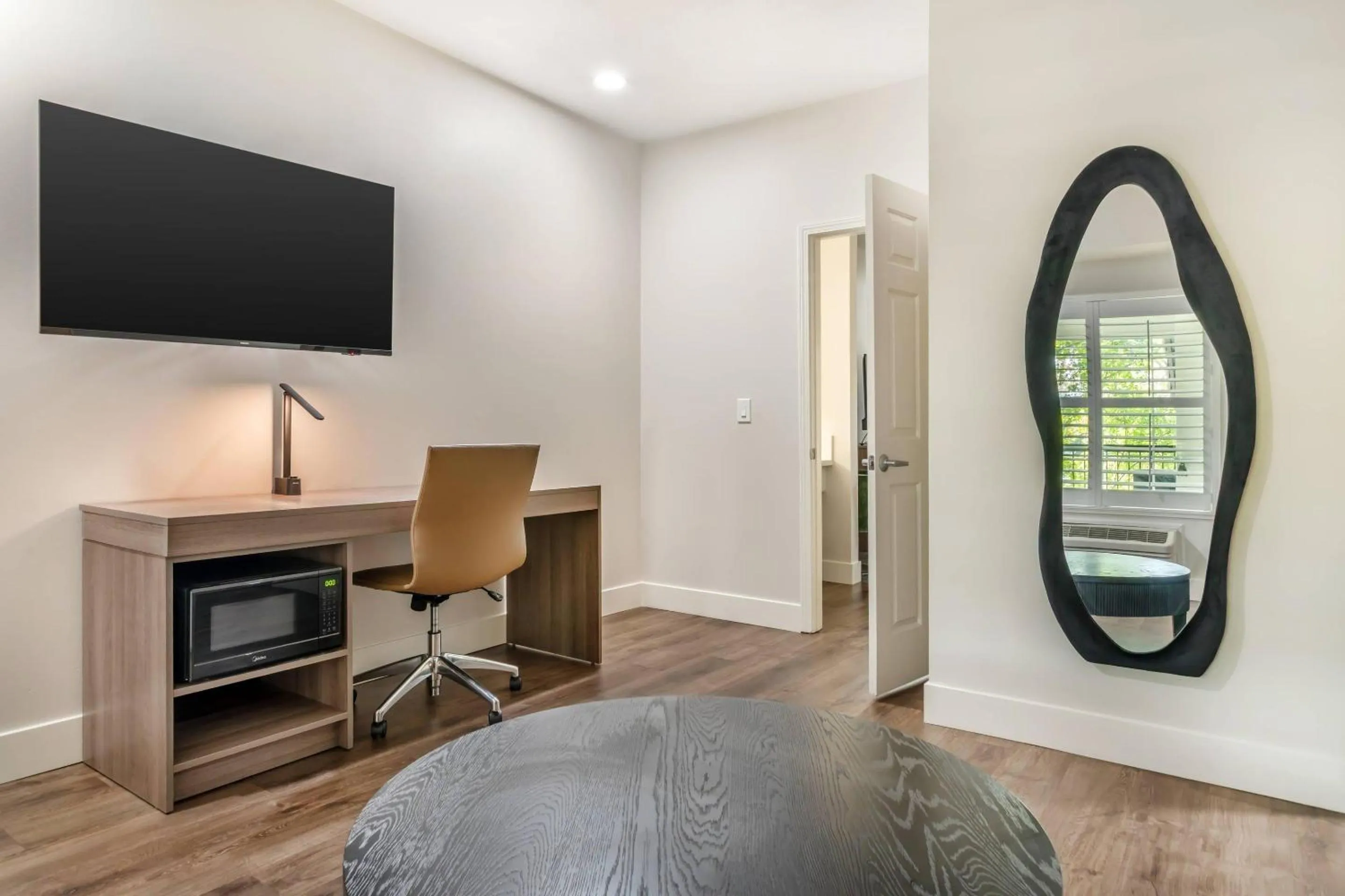 Bedroom in University Park Inn & Suites, an Ascend Collection Hotel