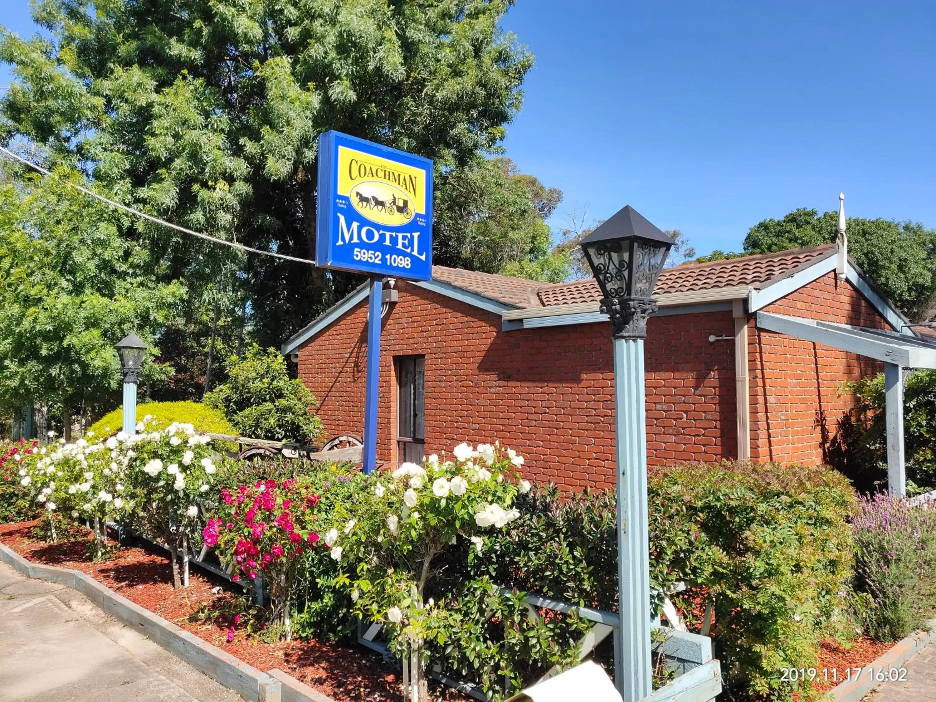 Property logo or sign in Coachman Motel and Holiday Units