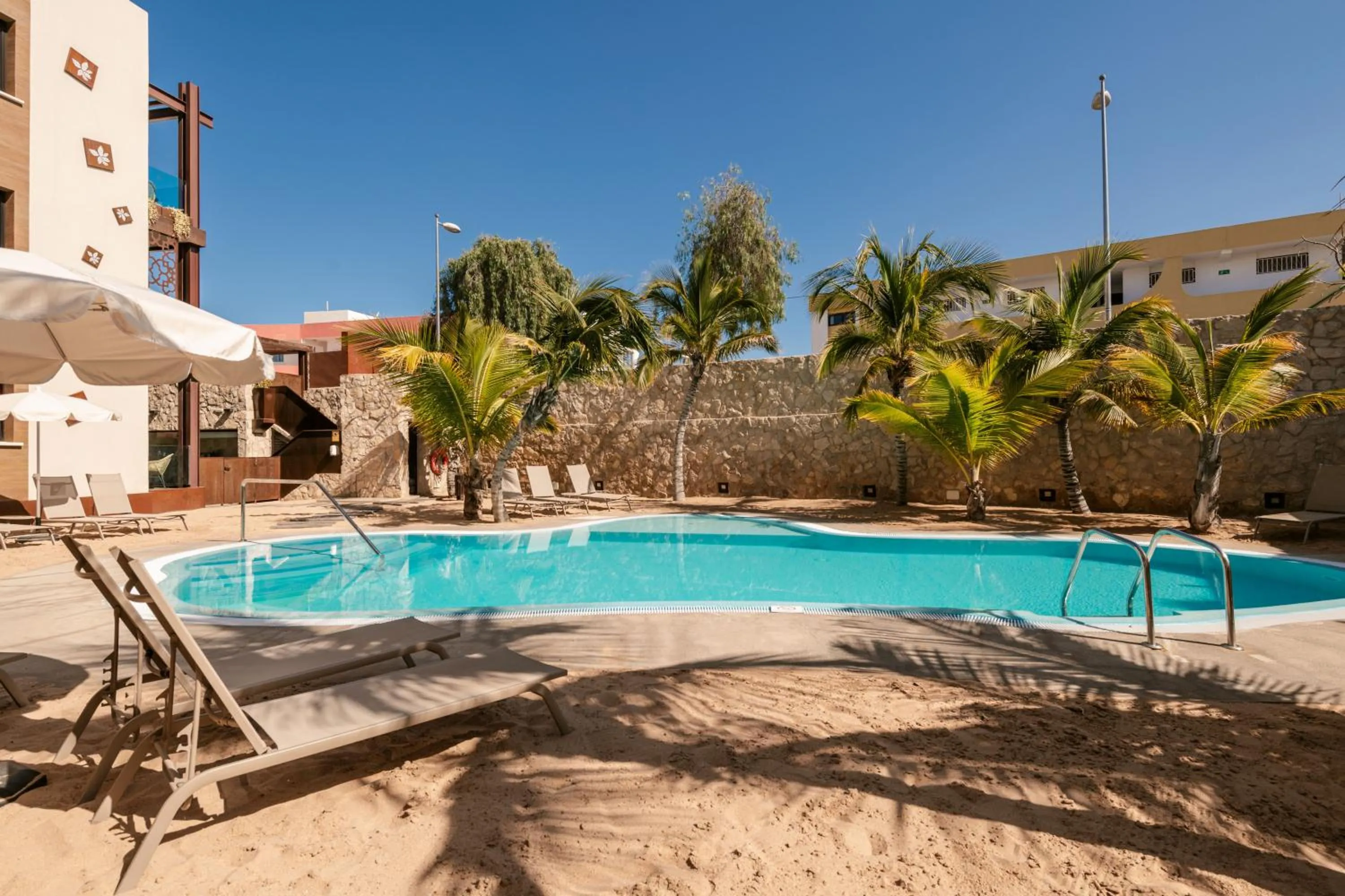 Swimming pool in Alhambra Boutique Apartments by PMC Resorts